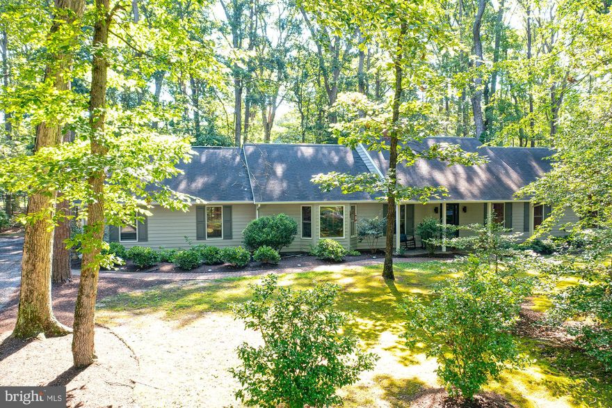 *NEW AERIAL PHOTOS ADDED*  Welcome to 9217 Martingham Drive, St Michaels - A beautifully maintained 3-bedroom, 2.5-bath rancher nestled in the sought-after Martingham community.  This inviting home sits on a wooded lot offering privacy and serene natural surroundings, while enjoying a prime location off the 10th fairway of The Links at Perry Cabin golf course.  Inside you'll find a thoughtfully designed single-level layout with spacious living areas, including a comfortable living room with a wood-burning fireplace, a formal dining area and an eat-in kitchen featuring all new appliances and countertops.  A sunroom just off the main living space offers a peaceful setting filled with natural views - perfect for an art studio, home office, or quiet reading nook.  The primary suite provides a restful retreat with multiple closets and an en-suite bath, while two additional bedrooms offer space for family or guests.  This low-maintenance home also features a convenient 2-car garage, ample storage, and a rear patio ideal for relaxing or entertaining while enjoying views of the mature trees and golf course beyond.  Enjoy the best of Eastern Shore living just minutes from historic downtown St. Michaels, waterfront dining, boutique shops, and marinas.  Don't miss this opportunity to own a piece of tranquility in one of Talbot County's most desirable communities.