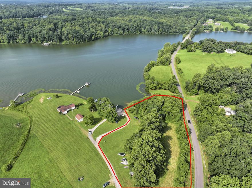 Don’t miss the opportunity to tour this beautiful home. Private showings are available through your local Lake Anna agents, and model homes are also open for viewing.

Looking for the perfect waterfront location with no HOA? Larson Custom Homes offers the highest level of quality, visible in one of our many model homes, all open on weekends or by appointment. Enjoy waterfront living at its best with nearly 5,000 finished square feet on the public side of Lake Anna with great water views.

A deep water boat dock is INCLUDED and ready for the 2026 season. Work with our dock designer to build your dream dock, as part of your new home contract. Your dock will be built at the same time as your home. Larson Custom Homes owns and operates its own boat dock company. A generous boathouse budget is built into your new home, so let us know what kind of lakefront living you're looking for.

As soon as you walk through the door, you’ll see 14-foot ceilings and walls of glass. Want more glass? Add it!
There’s no carpet—just luxury vinyl plank and tile flooring throughout. Enjoy upgraded painted shaker cabinets, quartz countertops, and oak stairs. 

The finished lower level includes a patio, huge rec room, media room, full bath, and a fourth bedroom.

Outside, you’ll love sitting on the large covered deck, perfect for a dining table and outdoor furniture. There’s also open decking off the floor-to-ceiling glass doors from the owner’s suite.

This home includes two-zone heating and cooling with propane backup and an upgraded well system. Quality throughout. Priced to sell. Current use as public area will be closed at the start of construction.
Other Larson Custom Homes plan will fit this lot!