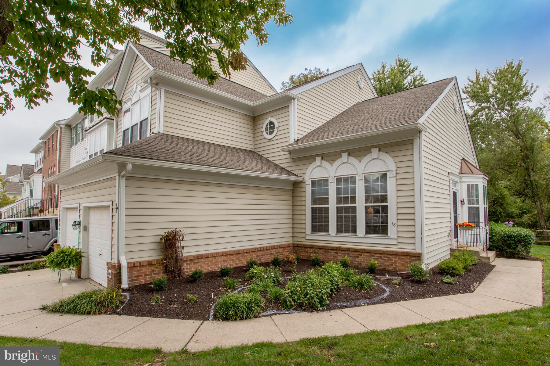 FIRST FLOOR MASTER in one of the rarely offered beautiful homes of the sought after Doylestown Station community!  This meticulously maintained three bedroom home provides you with plenty of space as well as exceptional convenience.  As you enter through the front door you are immediately greeted with the beautiful hardwood floors and the well appointed touches throughout.  Expanded crown moldings and wainscoting make a statement of elegance.  The living room on your left includes large windows making it bright and airy.  The dining room on your right features a large bay window.  The family room includes a gas fireplace with a floor to ceiling mantle and is a perfect place to relax or entertain.  The open floor plan continues through the breakfast area with vaulted ceiling and sliders to the maintenance free deck, right on into the gourmet kitchen.  Meal preparation will be a joy with plenty of cabinets, granite counters, stainless appliances, soft close drawers, gas cooking, recessed lighting, hardwood floors and a convenient pantry.  Enjoy the convenience and comfort of the main level primary bedroom with large windows and a walk in closet along with the primary bath with a double vanity and a linen closet.  The conveniences continue with the main level laundry room as well as a powder room.  Upstairs you will appreciate the large loft area along with two more bedrooms, each with large closets, as well as a Jack’n’Jill bathroom with a double vanity and a linen closet.  The finished basement provides even more space for entertaining and relaxing with custom built ins, recessed lighting, and a powder room.  There is also a large storage area for your convenience.  This home backs up to the wooded area providing natural views and seclusion, as well as the walking trail which leads to the nearby Central Park and Kid’s Castle.  Central Bucks schools and just minutes away from the shopping, dining, entertainment, and events of Doylestown.
