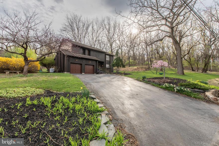 Welcome to your serene contemporary retreat at 1338 Santee Mill Road—nestled on a quiet, tree-lined 0.69-acre lot just minutes from vibrant downtown Bethlehem! This architecturally striking 4-bedroom, 2.5-bath home offers a seamless blend of modern style and natural beauty, delivering the privacy, comfort, and lifestyle you’ve been searching for. Step inside to an airy, light-filled layout highlighted by vaulted ceilings, skylights, and expansive windows that bathe the space in sunshine. A dramatic two-story foyer welcomes you into the formal dining room, sunken living room, and a bright family room featuring a stunning wood-accented wood-burning fireplace—perfect for cozy evenings. Just off the dining area, the sunroom offers the ideal spot to unwind, entertain, or enjoy a morning coffee with views of the peaceful landscape. The newly refreshed kitchen boasts stainless steel appliances, contemporary flooring, and a charming breakfast nook framed by panoramic windows, with direct access to the large back deck—perfect for al fresco dining or relaxing with nature all around. Upstairs, the spacious primary suite is a true retreat, featuring vaulted ceilings, oversized windows, and tranquil treetop views. Three additional bedrooms provide plenty of flexibility for guests, family, or a home office. Downstairs, the lower level offers unfinished space, a workshop area, and a luxurious walk-in sauna—your personal wellness escape. Outside, mature landscaping, a lush lawn, and a wooded backdrop create a sense of calm and connection to nature. Across the street, Camel's Hump Farm provides access to a community garden, outdoor yoga, and a whimsical nature playscape. Just past the community garden, which offers access to running trails and Housenick Memorial Park gives even more space to explore, run, and recharge. This isn’t just a home—it’s a lifestyle of peace, nature, and thoughtful design. Don’t miss the opportunity to make it yours.