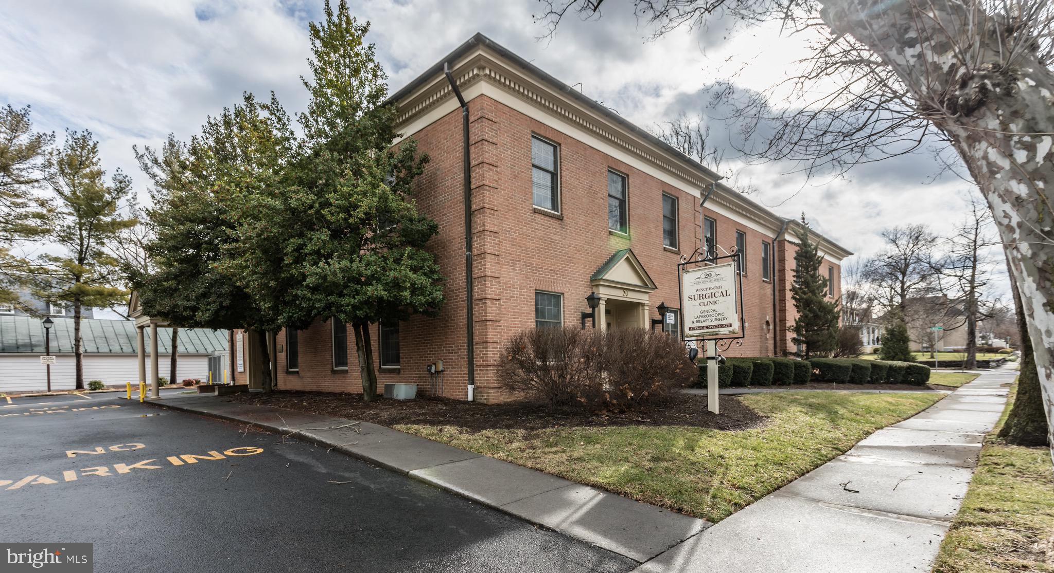 LOCATION, LOCATION! 17,000 sq feet Professional office space located in prime downtown Winchester's business district! All-brick building features 3 finished floors - the 2 above grade levels feature spacious reception areas, exam rooms, private offices, break rooms, kitchenette, bathrooms, and the finished basement provides great bull-pen / gathering space with tons of storage/shelving. Space was formally a medical office. Nice details provide lots of character throughout, including some hardwood floors, crown molding and chair rail. Elevator and multiple staircases for accessibility options. Private parking lots provides 45 parking spaces! ALSO LISTED FOR LEASE - MLS #VAWI2003440