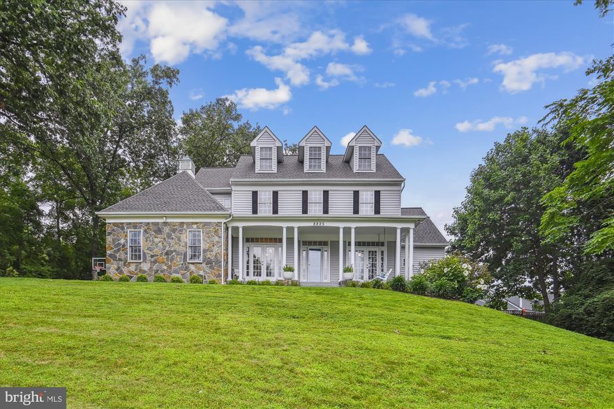 Experience the charm of a Southern-style estate, nestled atop a serene, secluded hill, offering panoramic views of a lush front lawn, a tranquil backyard paradise, picturesque landscapes, and mature trees. The custom-built, four-level home is perfectly located on a sought-after cul-de-sac, featuring a charming full-length covered porch, a stone façade, and a romantic swing for two, inviting you to relax and enjoy a refreshing glass of lemonade on a sunny summer day

With 8 bedrooms and a total of 8 full and half baths, this estate features an open floor plan, ideal for large gatherings or intimate evenings. Gleaming hardwood flooring, oversized crown moldings, chair railings, wainscoting, and built-in bookcases adorn the spacious formal dining room and living/Flex space rooms, which feature double French doors that open onto the large covered porch, perfect for entertaining guests. There are three staircases that are neatly tucked away from the main entrance. An updated gourmet kitchen that boasts two islands, exquisite granite counters, glazed cabinetry, high-end professional-grade stainless steel appliances, and a sunny eat-in kitchen outfitted with custom plantation shutters. 

The two-story ceiling family room features tall windows and two sets of French doors that provide a picturesque view of the backyard and changing seasons. Enjoy the outdoors year-round with the screened gazebo, fully fenced yard with a lovely garden, and gas fireplace for chilly fall and winter days.  The daylight, fully finished, walk-out lower level is an entertainment haven, that offers a spacious recreation room, custom-built solid maple wood wet bar with wraparound seating, recessed lighting, built-in kegerator, pool/ping pong table, workout room, and another bedroom with a full bath and large walk-in closet. And for added peace of mind, a one-year-new backup generator powering up to 90% of the house, ideal for telecommuting, medical professionals, techies, or Netflix enthusiasts can work and play from home with peace of mind, you'll never have to worry about a loss of power. This property is ideal for the fastest-growing, multi-generational segment and will not disappoint. Conveniently located just minutes from the Vienna and Dun Loring Metros, Fairfax Hospital, the Mosaic District, all major commuter routes, schools, and shopping galore. This home is sure to make you the envy of all your family, friends, and colleagues.