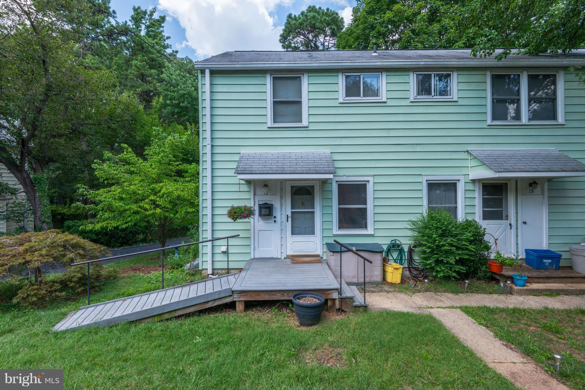 Sought-After End Unit W/ 2 Full Baths, An Addition, And A Large Storage Shed!!!! With a view of the "100-acre" woods, a deck to enjoy quiet afternoons, and close proximity to the assigned parking space, make this location prime for many Buyers! The main level addition previously served as a bedroom. The washer and dryer are stacked in the addition, leaving more dining space off the kitchen.