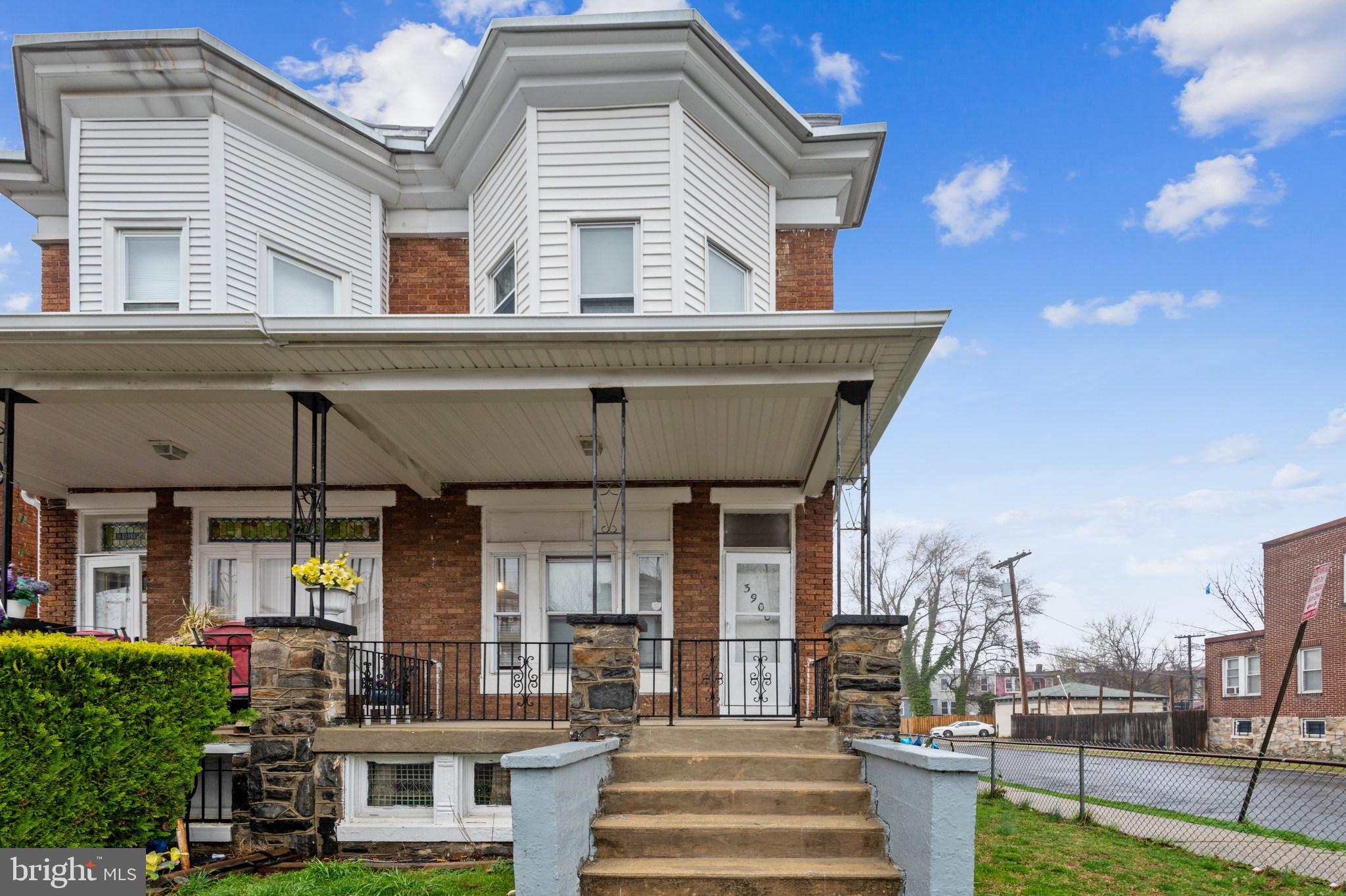 Welcome to this renovated, beautiful front porch end unit row house ready for move in. Featuring a large living room, separate dining room on the main level with an ample sized kitchen that leads out to the back patio. Great fenced in yard in the front, back and side of the brick home. Upstairs you will find 4 bedrooms. Easy access to shopping and main roads. Make this your home.
