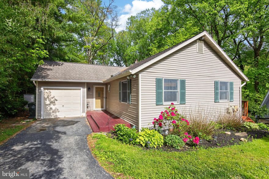 Welcome to 1121 Vermont Lane, a single-family home nestled in a cul-de-sac within the desirable Brandywine Greene neighborhood. Located in award-winning Downingtown Area School District, this well-kept home offers 2 bedrooms, 2 full bathrooms, a finished basement, and a small garage ideal for extra storage. Enter the home into a bright and open living area, with vaulted ceilings, skylights, and a wood-burning fireplace – perfect for ultimate comfort throughout the winter months. The living room flows into an eat-in kitchen with generous cabinet space, a built-in pantry, and ample natural light. Off the kitchen are sliding glass doors that lead to a large two-tiered deck over the backyard, which is surrounded by woods, adding privacy to this great outdoor space, perfect to enjoy long summer nights. The main level features two spacious bedrooms and a full bathroom, with ample closet and storage space. The large, finished basement provides tons of extra living space for entertaining, laundry, and a bonus room that would be perfect for a home office. With easy, direct access to both Downingtown and West Chester, the location of this home could not be more ideal. Schedule a showing to see all this lovely home has to offer!