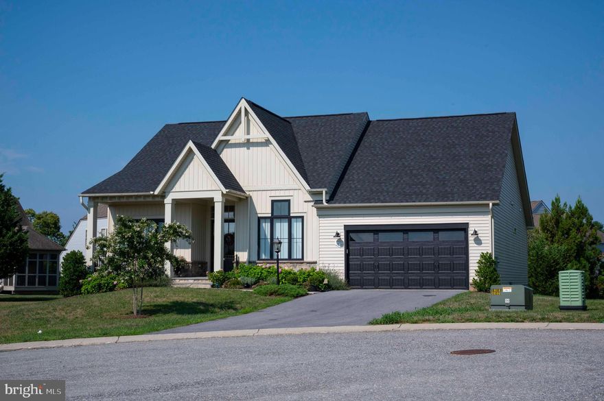 Welcome to the gated Beallair community in this historic neighborhood nestled
between Charles Town and Harpers Ferry. This beautiful home at the end of a cul-de-sac offers an Exceptional Craftsman / Farmhouse style open concept floor plan with individual living space areas.  Back and side yards are generously sized. The flowing floor plan gives max privacy to all 3 bedrooms and baths. Expansive by-pass doors off the dining area bring the beautiful outside spaces indoors. The kitchen provides many upgrades including stainless hood and appliances, oversized island, upgraded counter tops, coffee bar, and much more.  Cozy screen porch is a great place to entertain or just relax after a hard day at work.  The entry way from garage is sheer perfection in design and space. Boasting an oversized pantry, powder room and laundry including French drying rack.  It’s all about the little touches in this home. The living room has custom built bookshelves for all your collectibles or theater equipment.  Beside the gas fireplace will be a great place to hang out this holiday season while waiting for the fresh snowfall to appear.   2 additional bedrooms flank the formal entry way in true elegant fashion.  The Primary suite provides private space with a touch of peaceful relaxation.  Enjoy the tiled shower and private retreat this space offers. It’s all about you here.  The entire family will love the lower-level media and exercise room and if it's storage you need, we have tons of space.  Community areas include walking trails and beautifully appointed garden areas with historical structures from a time gone by.  The historical Manor House, home of George Washington’s great grand-nephew, and gardens date back to a time when craftsmanship was done with pride and hard work.   If that's not enough; the HOA includes full lawn care, snow removal, basic landscaping and trash service. Enjoy the lower taxes, quiet, and beauty of West Virginia in this lovely home for your next stage.  Visit today.