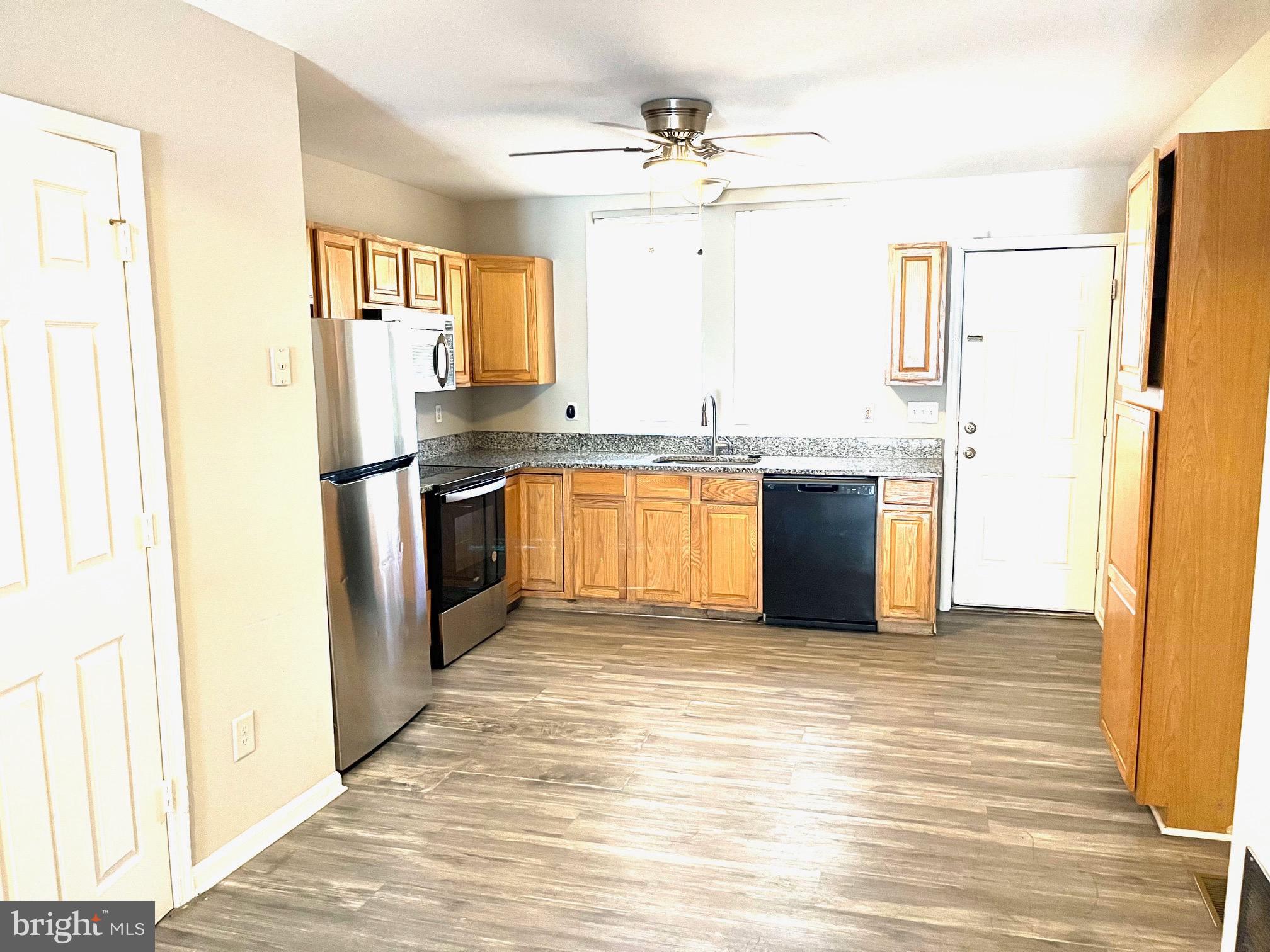 Here's a great opportunity to share in on an awesome property which has 2 kitchens along with 2 full and 1 1/2 bathrooms. This property could easily be converted into 2 separate units with unit #1 being a 1 bedroom 1 bathroom and unit #2 being 3 bedrooms and 1 & 1/2 bathrooms. This property is turnkey, all floors on the upper level were just replaced the 3rd week in April of 2025. The main floor has the sought after open concept with plenty of natural sunlight. The basement level offers a 4th bedroom/office/fitness center or storage. The property is conveniently located near Johns Hopkins Hospital, near public transportation, downtown entertainment and so much more. There is a private fenced in yard with a deck on the rear of the home.