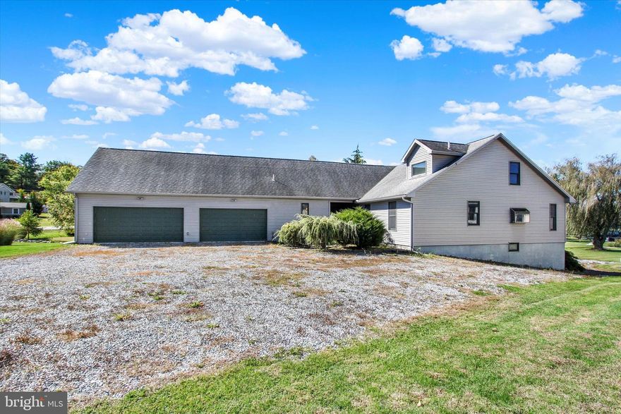 Welcome to 400 Lake Meade Drive, East Berlin.  This waterfront home is located on Lake Meade and is waiting for the new owner to enjoy all it has to offer.   There are a few remaining projects on the inside that the seller must complete.    Over 4,000 square feet of finished living space with a 2nd lower-level kitchen and a walkout to your waterfront lakeside.   5-6 bedrooms, 2.5 baths, and a very spacious family room with a bar and a pool table.   The current owners have made many interior upgrades to their home and feel this is the time to offer it to a new owner.   As you walk in the front door, you will feel the warmth that this home has to offer.   Spacious kitchen with new countertops and all appliances included.   The center island in the kitchen provides extra counter space, and there is room for your dining room table with a view of the lake.   The laundry room is located on the main level of this terrific home with a half bath.    There is a bedroom and a full bath on the main level, as well as an additional room for an office or workout room with a lake view!   As you take the stairs to the second level of the home, you will find a primary bedroom, a full bath with a soaking tub, and a walk-in shower.   A full wall of closet space as well.   The lower level (includes 2 sets of sliding doors on the lake side) offers a second kitchen, a walk-in closet, 2 additional bedrooms, a full bath with a tub/shower, plus a bonus room that could be used for an office that has a water view!   2 separate utility rooms for mechanicals on the lower level.  This is a fantastic space for in-laws, extended family, and friends, as it offers a separate entrance and a driveway that conveniently wraps around the home.  The attached 2-car oversized garage is large enough for boat storage and your vehicle, with plenty of additional storage space.   Above the garage, there are two additional rooms that could be finished to your specifications.   
Enjoy sitting under the willow tree on the lakeside as you unwind from your day!   The floating dock comes with this property and is currently shared use with the neighbor.   Call your agent and schedule a tour today!