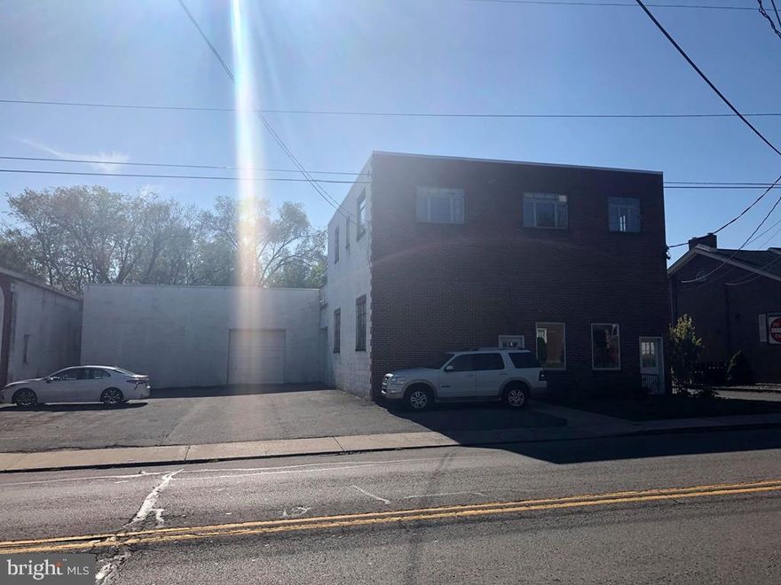 Space and more space in the right location. Own your own business on heavily traveled Fourth St just before Lowes.Over 6,900 sq ft of warehouse, office space and additional upstairs apartment or more offices. Warehouse has 4 overhead garage doors. All brick or block exterior. Property has two high efficiency gas furnaces with central air. Warehouse is unheated. Several extra storage spots off of warehouse. 10 off street parking spaces. No better time to excel.