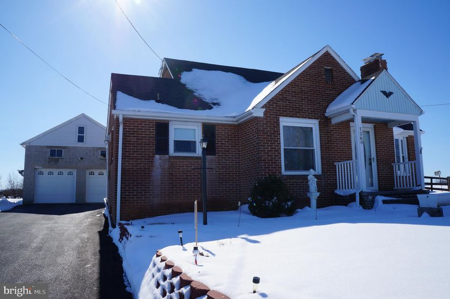 Beautiful cape cod style brick 3 bedroom with 2 bedrooms on main floor, office/nursery area upstairs, central air, fireplace, detached cinder block 2 car garage with workshop area and space above garage for storage/addl workshop area.  Nice yard in South Western schools, excellently maintained with wood working accents inside.  Fantastic home in this price range.  Don't miss out!