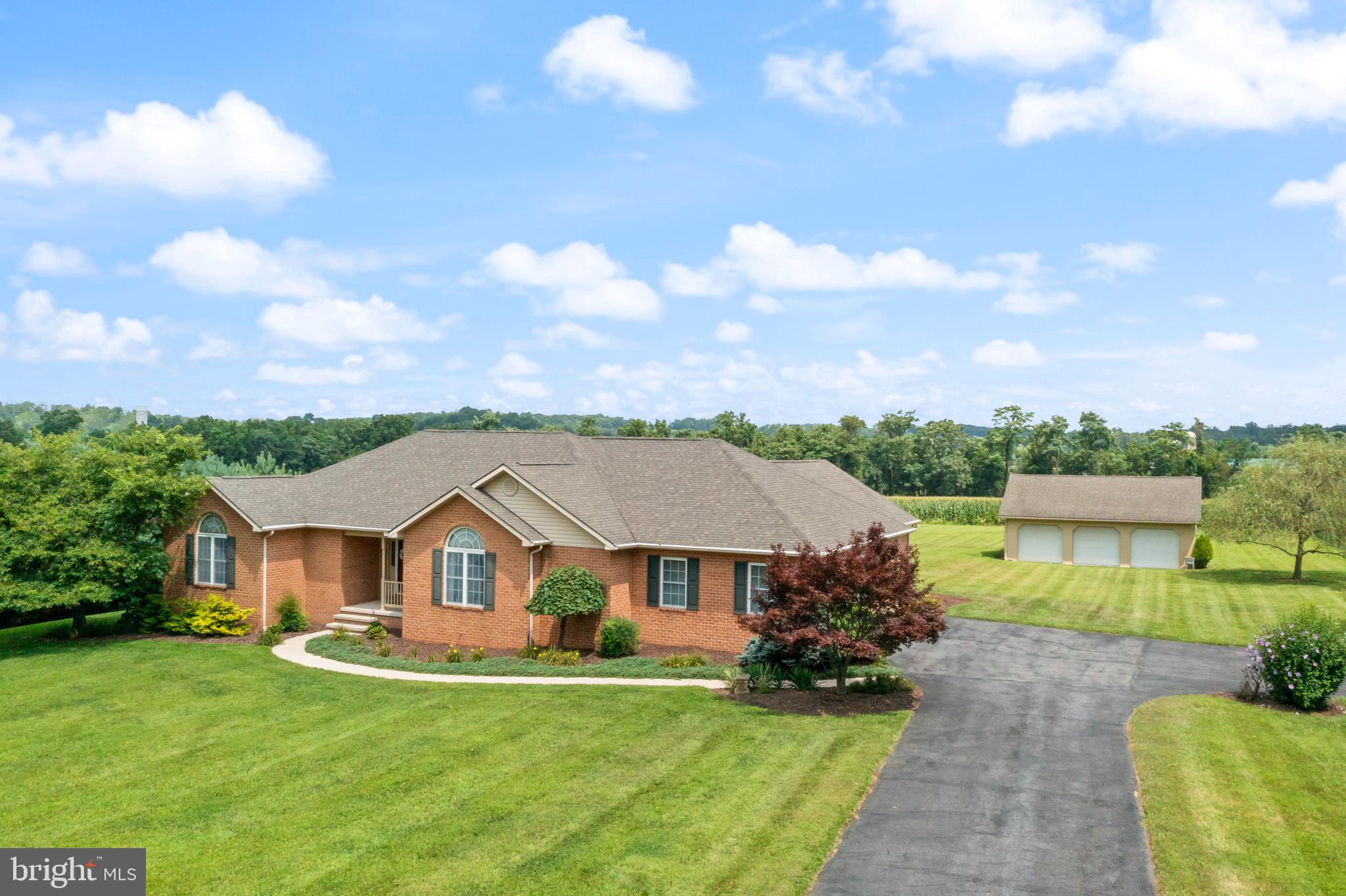 NO HOA RULES OR MONTHLY FEE'S - LOW TAXES - EASY ACCESS TO interstate 70.
Nothing but quality materials and craftsmanship throughout this CUSTOM BUILT- ALL BRICK rancher.
4674 sq/ft home with 2337 sq/ft of living area on main level, a complete guest suite in lower level and lots of additional space that can be finished.
Built to accommodate wheelchair access. 36" interior doors, 48" hallways, high toilets, large shower pan, ramp in into home from attached garage.
Private 1.85 acres - Attached 2-car garage and detached 3 car garage w/ 240 electric & a storage shed.
MAIN LEVEL: built with open space as a priority
Kitchen- granite counters, oak cabinets
Breakfast room- sliders out to large back patio.
Dining room - hardwood floors, cathedral ceiling
Living Room - HUGE! hardwood floors, vaulted ceiling
Laundry Room - direct access to outside, deep sink, cabinets/counters galor
split bedroom design - Master on one side, 2 additional bedrooms & bath on the other side of home.
Master bedroom- hardwood floors, attached bath, huge walk in closet
Bedroom #2 - cathedral ceiling, hardwood floors, walk in closet
Bedroom #3 - hardwood floors
Buddy Bath - connects bedroom 2 & 3
LOWER LEVEL:
Fully finished in-law suite with a sitting area, attached bath & walk in closet
High ceilings in unfinished area will make it easy to add additional living space
Extra wide walk up stairs to backyard
Large safe conveys with home
3 BAY DETACHED GARAGE
work benches * sided with T1/11 ready for brick installation * 240 electric
DETACHED SHED
wood floor * T1/11 siding
Heat pump, water heater, water softener & UV light services regularly