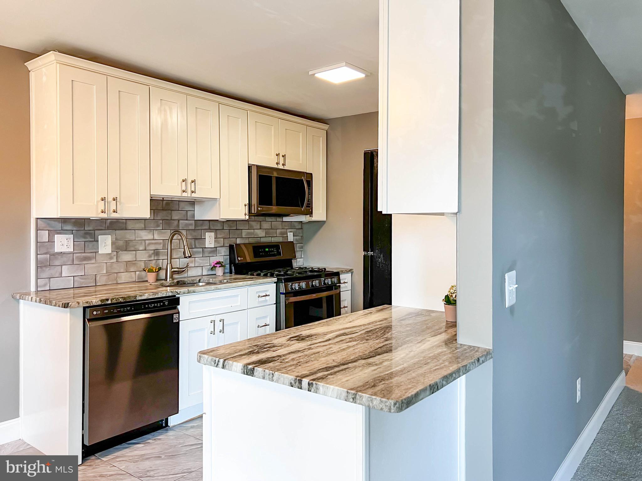 Top floor condo features 2 BR and 1 BA. Kitchen has new SS appliances and cabinets with granite countertops and glass tile backsplash. New flooring throughout the home includes tile in kitchen and BA, carpet in LR and BRs. Custom paint though-out. Private balcony off of the LR. Master BR has walk-in closet with custom storage. This condo is close to Metro, Bus, and major transportation.