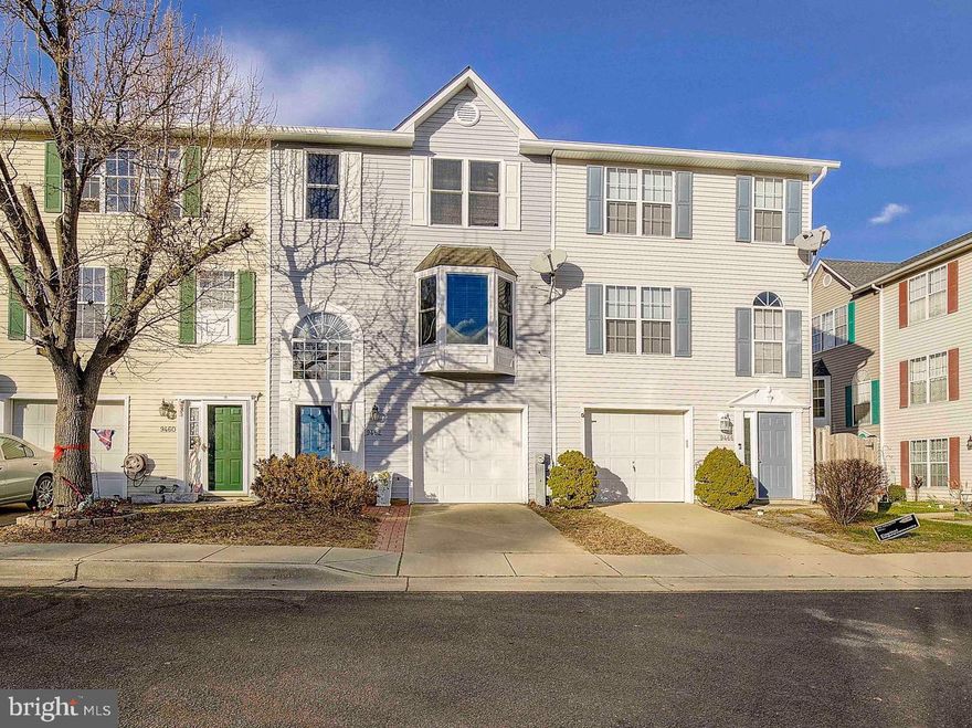 Walk to the beach, boardwalk & restaurants from this fantastic location in North Beach!  3-level townhouse in excellent condition. Kitchen has been beautifully updated with stainless steel appliances, cabinets, sink/faucet, backsplash  and leather-finish white granite countertops!! Lots of light with this open floor plan and bay windows in the living room.  Sliders off main level lead to a large, multi-tiered deck.  You'll love that the deck  has stairs leading down to the fenced yard --great for for pets! Top level has three bedrooms including primary bedroom with cathedral ceilings, an ensuite full bath and large closet with organizers.  Has two gas fireplaces--one in living room and one in the finished lower level that could be used as a fourth bedroom, recroom, office or gym.  Lower level has a half bath and a washer & dryer closet.  Lots of parking here with a one-car garage, personal driveway for a second car and an assigned parking spot in general area for a third car parking. Home is well maintained with new garage door in 2017 and a new roof in 2018.  Enjoy living within town limits -- on public water, public sewer, and free beach passes!  Community also has access to trails to wetlands park and boardwalk.  Easy commute to Joint Base Andrews, Annapolis, & Washington DC!!!