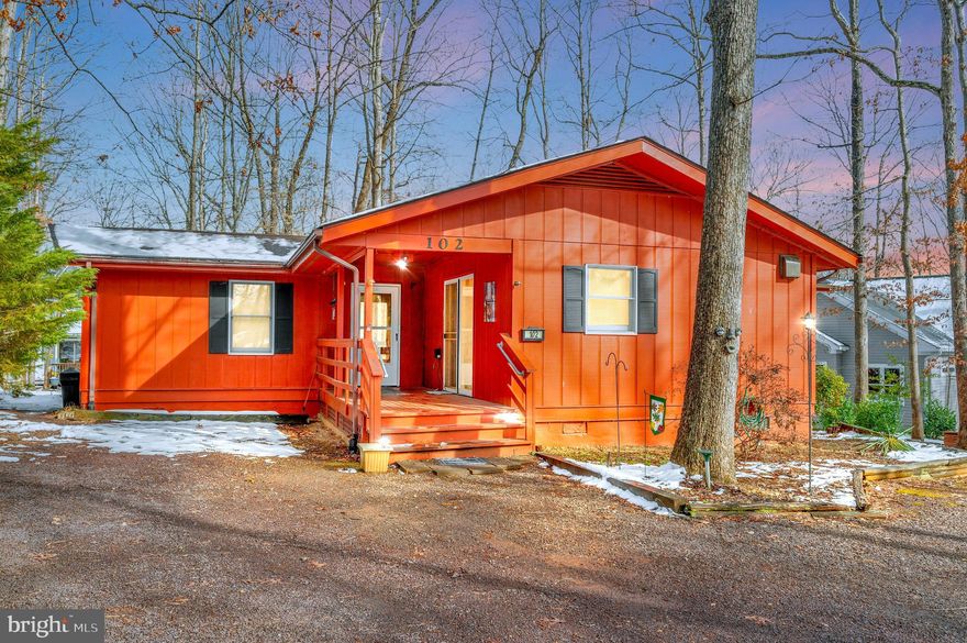 Sitting on a cul-de-sac street in a waterfront neighborhood not far from a lakeside beach, local parks or the clubhouse complex is this rustic rambler.  This open great room style cedar home offers a unique floor plan of one level living with lots of natural light.   The washer & dryer are conveniently off the great room in a hall closet. Two bedrooms have slider doors that lead onto exterior decks.   The deck off the great room is perfect spill-over space for entertaining.  In the backyard  is also a storage shed for yard or lake play gear. All systems work in this home; the roof  is NOT original/ was replaced with 40 yr shingles & still has useful life & the  heat pump is  operating well  and beyond its typical life . A few of the dual pane windows  are fogged. All systems and appliances are being conveyed in as-is condition.  Consider this well-located home for a lake retreat or an investment option. It has a long term rental history.  Ready for a make-over & new family to love!!