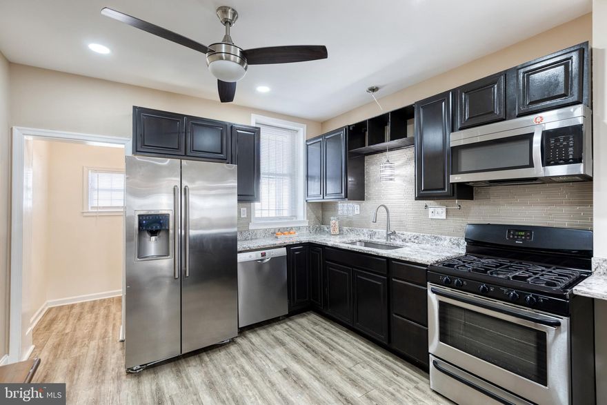 Just blocks from Patterson Park, this charming Highlandtown rowhome offers approximately 1,500 square feet of stylish living space. The open-concept main level features high ceilings, elegant columns, and graceful arches that create a sense of openness and character. A spacious living and dining area includes a convenient wet bar, perfect for entertaining. The beautifully updated kitchen offers ample cabinet space and modern finishes, while a full main-level bathroom adds extra functionality.
Upstairs, discover three generous bedrooms and a second full bathroom, along with plenty of closet and storage space throughout. The lower level provides additional storage and a laundry area. Enjoy city living at its best with easy access to shops, restaurants, and the vibrant energy of Patterson Park just around the corner. Welcome home!