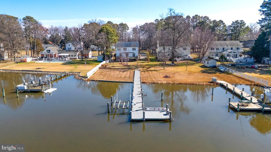 Welcome to easy waterfront living on Kent Island. Western exposure to beautiful sunsets. Tucked away on a quiet street, this 5-bedroom, 3.5-bath home offers an open floor plan with new flooring throughout the main living area and upstairs, creating a bright and comfortable space that flows effortlessly for both everyday living and entertaining. Out back, enjoy the beautiful pier, perfect for boating, crabbing, fishing, kayaking, or paddleboarding along with a spacious deck and hot tub that make relaxing by the water second nature. Public sewer adds convenience, while the 2-car garage provides plenty of room for storage, hobbies, or water gear. All of this just minutes from Kent Island’s shops, restaurants, and local favorites, close to everything, yet peacefully removed. Waterfront living with space, updates, and location, all under $1M. Schedule your showing today!