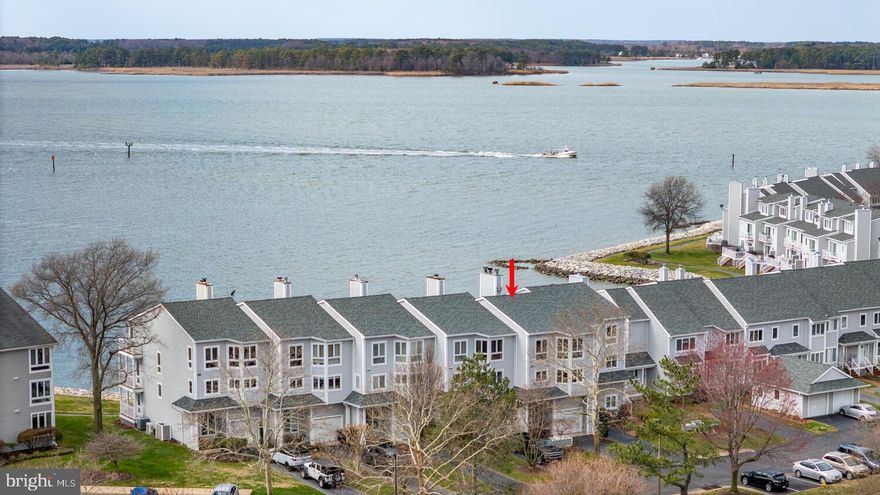 Finally, one of the highly sought-after “Big Six” Waterfront Townhomes is available—complete with an attached garage and deeded boat slip (M1-PB-11) in the protected North Marina. This exceptional property truly represents the best of Waterfront Living.  Fully renovated just four years ago with top-of-the-line finishes and beautiful coastal design throughout. Features include ¾" luxury vinyl plank flooring, a bright designer kitchen with commercial-grade Thermador stainless steel appliances. At the center of the space is a  stunning custom “River Table” island that serves as an unforgettable showpiece..
Floor-to-ceiling glass captures breathtaking Eastern Bay views and fills the home with natural light.   Each level offers its own deck - perfect for entertaining or simply enjoying spectacular Water Views and sunsets just steps from your door.
The first level offers a versatile bonus room ideal for a recreation room or additional primary suite, complete with a beautifully designed bath and modern fireplace. The open-concept kitchen, dining, and family room feature another fireplace (gas burning) and sweeping WATER VIEWS. The spacious primary suite offers incredible waterfront views ,vaulted ceiling, and nothing less than a magazine-worthy bath. Two additional guest rooms and a beautifully appointed hall bath complete the upper level.   Even the garage is decorated "Retro Flair" including a kitchenette , extra storage, and still room for your car!   This is the perfect get away or better yet, live here year around!  It's the perfect one of a kind coastal retreat!   
Residents enjoy a beautiful clubhouse with party room, fitness center, and saltwater pool, along with tennis/pickleball courts and a basketball court. A scenic 1.5-mile waterfront path connects to the Cross Island Trail, a 38-mile award-winning trail linking beaches, parks, marinas, shops, restaurants, coffee spots, and ice cream shops. Just 7 minutes to Queenstown Harbor Golf and Prime Outlets, 20 minutes to Annapolis and Easton, and under an hour to Washington, DC and Baltimore. It’s not just a home—it’s a lifestyle. 🌅🏡