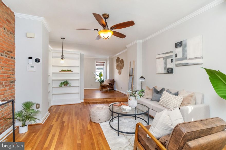 Welcome to 2025 Gough Street, a classic Fells Point gem blending historic charm with modern updates! This spacious three-level home offers over 2,000 sq. ft. of thoughtfully designed living space, featuring exposed brick, cherry wood floors, and an inviting layout perfect for city living.

Step inside to a warm and cozy living room with a charming reading nook, seamlessly flowing into the dining area and kitchen. The kitchen boasts granite countertops, updated appliances, and a versatile additional space—perfect as a wet bar, pantry, or laundry area.

The second floor offers two spacious bedrooms and a beautifully updated full bathroom with a double vanity, clawfoot tub, and separate stand-up shower. Upstairs, the stunning third-floor primary suite impresses with vaulted ceilings, exposed brick, a walk-in closet, and a spa-like ensuite bath featuring a jacuzzi tub, double vanity, and custom lighting.

This home has been well-maintained with key updates, including a reinforced roof, regrouted showers, and upgraded major appliances. The backyard is a peaceful retreat, and convenient offsite parking is available just behind the house for $300/month, with a prepaid spot covered until closing.

Located just a short walk from the Fells Point waterfront, Canton, Patterson Park, and top neighborhood eateries, this home is in the heart of it all. Don’t miss your chance to own a piece of Baltimore’s historic charm with all the modern conveniences you need!