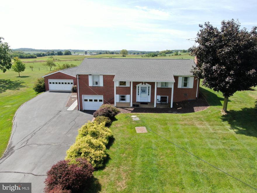 BEAUTIFUL HOME IN THE COUNTRY! Check out these views! The home features 5 bedrooms, 2 full bathrooms, Living Room, Family Room, Dining Room, Laundry Room, Attached one car oversized garage, Detached 2 car oversized garage, Roof is only 5 years old! All brick home is positioned on .72+- acres with beautiful views of the surrounding farms! Imagine having gatherings on the outdoor brick patio! Make this beautiful home yours!