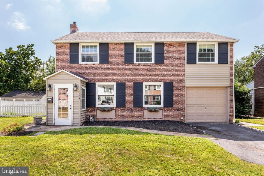 Welcome to this immaculate red brick 2-story home with timeless curb appeal. The main level features a living room with built-in bookcase/cabinet and closet, a large formal dining room with closet, and a stunning newer kitchen addition with granite countertops, abundant cabinetry, a cookbook nook, built-in dishwasher, microwave, and refrigerator. An alcove off the kitchen offers a powder room and laundry area. From the kitchen, access the newly finished basement and a covered patio overlooking the fully fenced backyard with garden shed. Upstairs offers 4 bedrooms (or 3 plus a large playroom/office) with ceiling fans and generous closet space, along with a remodeled marble bathroom. Whitemarsh Hills is known for its winding roads, pretty gardens, and “Pride of Ownership.” Conveniently located near Manayunk, Chestnut Hill, Ambler, Conshohocken, and major commuter routes including trains, buses, and highways.