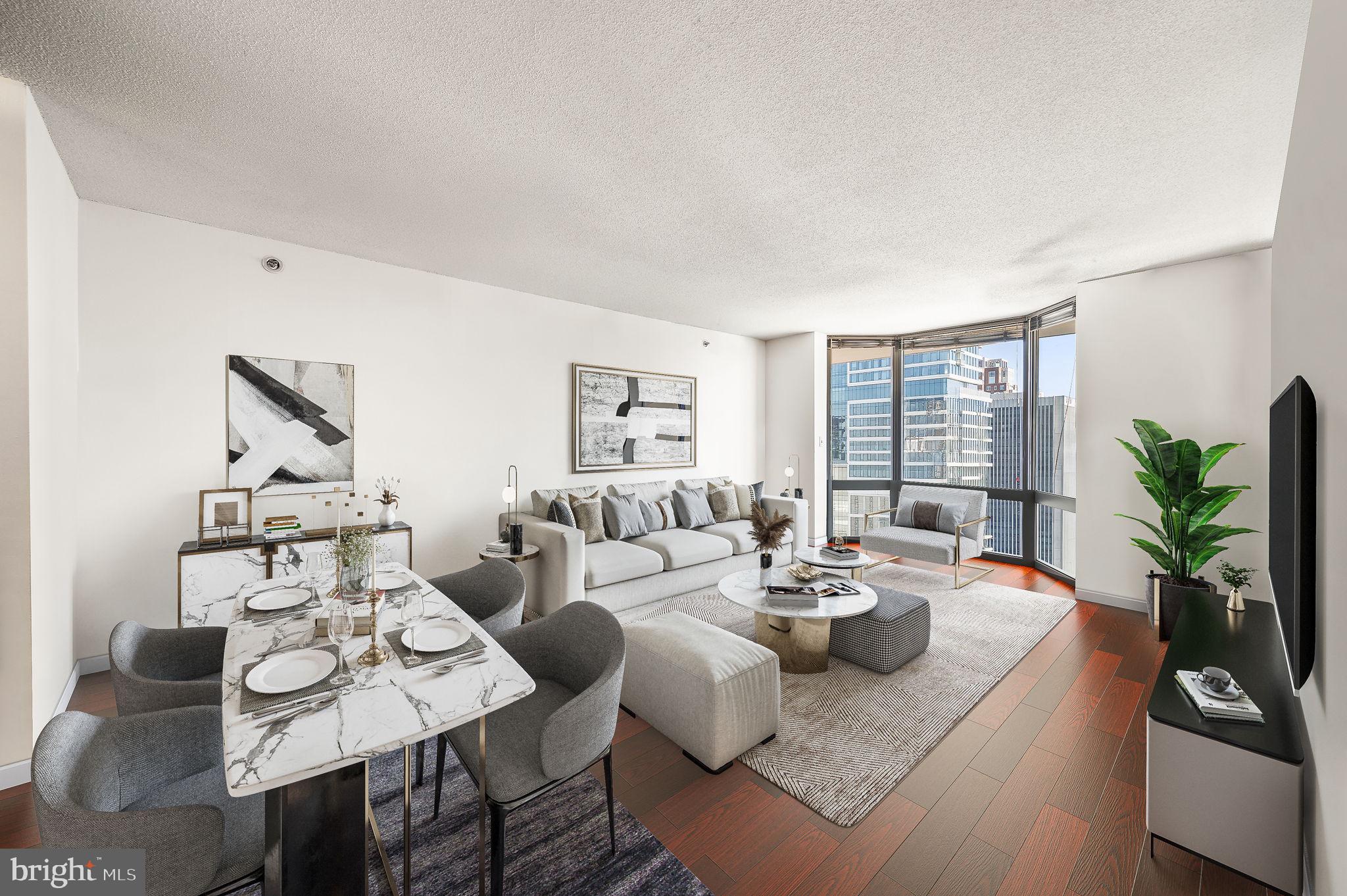 High above the city on the 29th floor, this renovated 1-bedroom at the Wanamaker House offers sweeping views of Rittenhouse Square and the Philadelphia skyline through floor-to-ceiling bay windows in both the living room and bedroom. Inside, you'll find warm wood flooring throughout. The modern kitchen features granite countertops, new cabinetry, and stainless steel appliances—perfect for both everyday cooking and entertaining. The spacious layout flows effortlessly from room to room, with abundant natural light and stunning views at every turn. Residents of Wanamaker House enjoy a 24-hour door person, gym with sauna, reading lounge, entertaining space with a catering kitchen, business center and a seasonal rooftop pool with panoramic city views! An assigned parking space can be rented for an additional monthly fee subject to availability. The building is cat friendly. The convenient location of Wanamaker House allows for easy access to 30th Street Station, Penn, Drexel, Wharton School of Business, The Schuylkill River path, and is just steps away from Rittenhouse Square, and numerous desirable restaurants, cafes, boutiques, and much more.