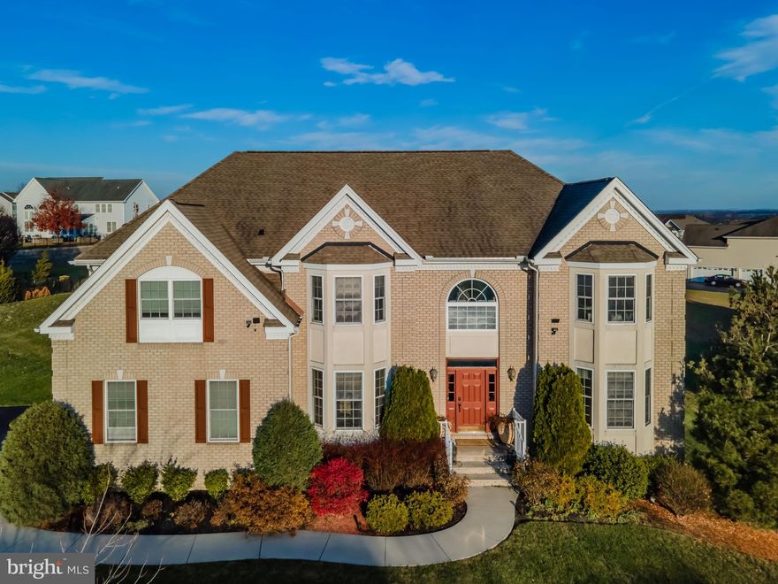 Here is your chance to own in the Bella Vista development, nestled within the highly coveted Cumberland Valley school district. This magnificent 5-bedroom, 4.5-bathroom residence is a perfect blend of  space, and functionality.

As you enter through the grand two-story foyer, the warmth of the home envelopes you, immediately showcasing the elegance of the front formal living room and dining room adorned with gleaming hardwood flooring. The family room, boasting a gas fireplace and dramatic 20' ceilings, is a focal point that is both inviting and awe-inspiring. The kitchen is equipped with a center island, a walk-in pantry, and adjoining breakfast/dining rooms that provide ample space for both meal preparation and entertaining. The main level also features a versatile office, ideal for a productive work-from-home space or conveniently used as a fifth bedroom.

Journeying to the second level, discover a thoughtfully designed layout with four bedrooms. Two generously sized bedrooms share a full bath in the hall, catering to the needs of bedrooms 3 and 4. Bedroom 2 enjoys the luxury of an ensuite bath, while the opulent owner's suite steals the spotlight with a full-size sitting room, tray ceiling, his and her walk-in closets, and an oversized primary bath featuring a dual vanity, jacuzzi tub, and tiled shower.

For added entertainment and recreation, the full basement extends the living space, offering a large open area for a second family room and game room completed with another guest room and additional full bath  ensuring your home is always ready to host friends and family.

This residence truly encompasses the essence of luxurious living, with its well-appointed spaces, thoughtful finishes, and the perfect blend of comfort and sophistication. Don't miss the opportunity to make this exceptional property in Bella Vista your new home.
