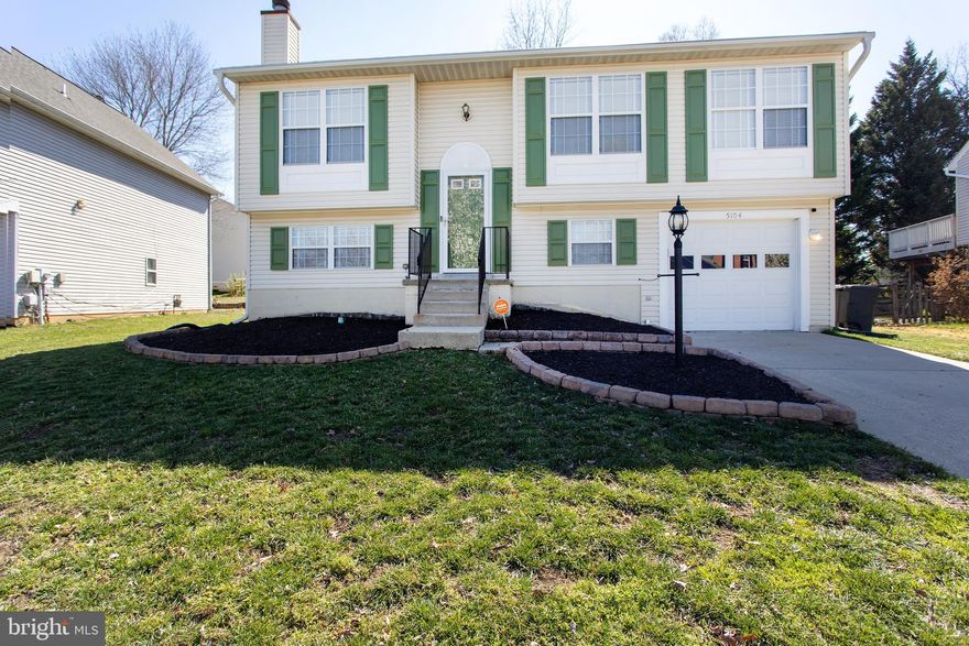 This beautifully updated split foyer home is located in the desirable Dorchester neighborhood of St. Charles. Lovingly maintained, it features 3 bedrooms with the potential for a 4th on the lower level—simply add a door. The home boasts newer laminate flooring (installed in 2020) throughout. The kitchen offers newer granite countertops (2021), stainless steel appliances including a refrigerator with ice-maker, a dishwasher and a gas stove.  Plenty of cabinets and a rolling island provide plenty of storage space. The spacious living room is filled with natural light, and the large deck offers a serene view of the expansive, fully fenced, private backyard. The primary suite includes a walk-in closet with custom shelving, and a recently remodeled full bath is accessible from both the suite and the hallway. Two additional nicely sized bedrooms are also located on the upper level. Downstairs, you'll find a large recreation room complete with a wood-burning fireplace, another recently remodeled full bath, and a flexible space that can be used as a bedroom, office, gym, or playroom. The lower level also features a sizable laundry room and ample storage space. The expansive one-car garage can accommodate most oversized vehicles.Other newer features include newer HVAC (2023), newer washer & dryer (2020), newer gutters (2021), newer security back door with built-in blinds (2022) and newer wooden blinds throughout (2020). You will enjoy the many neighborhood amenities, including a pool, pickleball/tennis courts, a playground, and miles of paved trails leading to a scenic lake. Commuting is a breeze with quick access to Route 210, providing an easy drive to Washington, D.C., and Virginia.