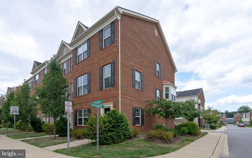 Home still shows like a model! Absolutely beautiful, larger end unit with brick front two car garage townhouse. This home features 3 bedrooms, 2 full and 2 half baths (with 4 bathrooms there should always be one unoccupied).  Upon entry to the home you'll walk in to an open floor family room/recreation room on the lower level with half bath, an under the stairs coat closet and extra storage for luggage or holiday decorations.  Continuing on as you make your way up the stairs you are greeted by an open floor plan with a plethora of windows providing plenty of sunlight.  A dining room that over looks the street through a gorgeous bay window and a wide open kitchen with island and stainless steel appliances.  There's a large living room just ready for the entire family to sit eating popcorn on movie night.  There's a tucked away powder room and large pantry to hold all the snacks.  The kitchen includes plenty of storage space as well, with the 42" maple cabinetry along two walls.  When it's time to retire at night you'll travel upstairs to 3 nice sized bedrooms and an owners suite with walk-in closet, spa inspired oversized bath and separate shower.  A secondary bathroom with linen closet inside provides space for all your toiletries, however a much appreciated necessity is the third floor laundry. Right there no more running up and down the stairs with a basket full of dirty clothes. 
There's a deck as well on the main level that lends itself to a quiet night with a cold drink in the summer months.  This home is just perfect for the right person and with eligible for the USDA loan program it makes this home 100% financeable with a zero down payment!  It's a must see  because it surely will not last long.