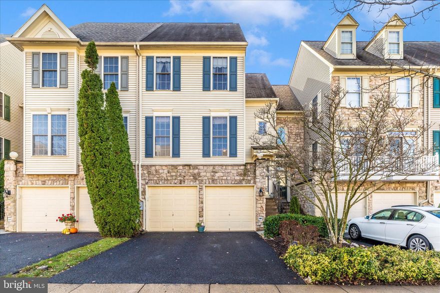 REDUCED!!! Welcome to this beautifully maintained townhouse in the highly sought-after Worman’s Mill community. Offering over 3,000 square feet of living space, this home features three fully above-ground levels—providing comfort and peace of mind without the concern of a basement. The entry level includes an oversized two-car garage, a spacious recreation room, utility room, and a large office that could easily be converted into an additional bedroom. There is also potential to add a full bathroom on this level. The main floor showcases a welcoming foyer leading to formal living and dining rooms, a well-appointed kitchen, and a comfortable family room with a gas fireplace. All the floors on the main level are beautiful hardwood.  A convenient half bath completes this level. Upstairs, the primary suite offers two closets and an ensuite bathroom with a dual-sink vanity, soaking tub, and separate shower. Additional bedrooms are filled with natural light, enhancing the home’s warm and inviting atmosphere. Recent updates include a new high efficiency gas HVAC system and a hot water heater installed just 2 ½ years ago. Outdoor living is made easy with two decks and a fenced backyard. This exceptional property combines thoughtful design, abundant natural light, and desirable updates in one of Frederick’s most coveted neighborhoods. Don't miss your chance to call this house your home!