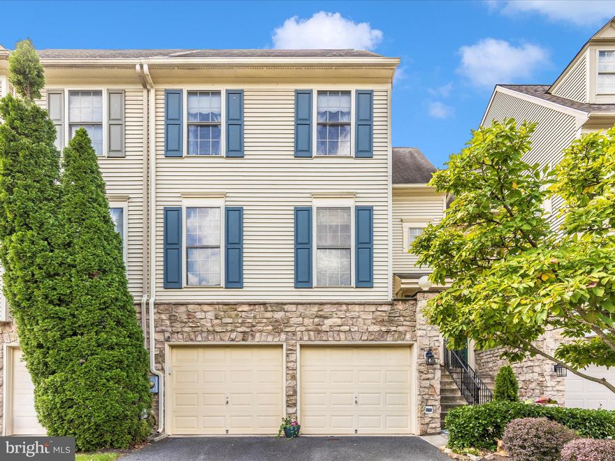 REDUCED!!! Welcome to this beautifully maintained townhouse in the highly sought-after Worman’s Mill community. Offering over 3,000 square feet of living space, this home features three fully above-ground levels—providing comfort and peace of mind without the concern of a basement. The entry level includes an oversized two-car garage, a spacious recreation room, utility room, and a large office that could easily be converted into an additional bedroom. There is also potential to add a full bathroom on this level. The main floor showcases a welcoming foyer leading to formal living and dining rooms, a well-appointed kitchen, and a comfortable family room with a gas fireplace. All the floors on the main level are beautiful hardwood.  A convenient half bath completes this level. Upstairs, the primary suite offers two closets and an ensuite bathroom with a dual-sink vanity, soaking tub, and separate shower. Additional bedrooms are filled with natural light, enhancing the home’s warm and inviting atmosphere. Recent updates include a new high efficiency gas HVAC system and a hot water heater installed just 2 ½ years ago. Outdoor living is made easy with two decks and a fenced backyard. This exceptional property combines thoughtful design, abundant natural light, and desirable updates in one of Frederick’s most coveted neighborhoods. Don't miss your chance to call this house your home!