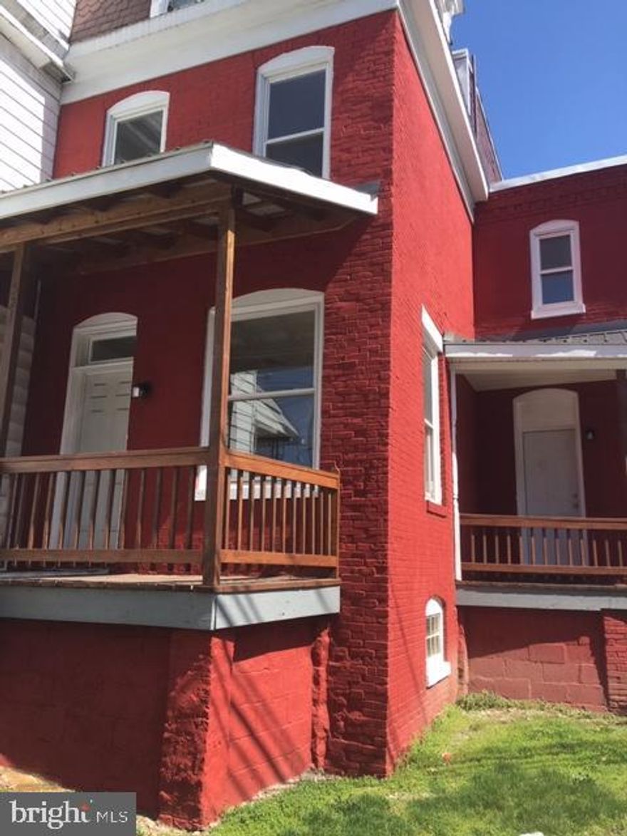 Completely remodeled 3 story on corner lot in the city. Features 4 BR's and 1 large bath, large remodeled kitchen, formal LR and DR. All new in past year: Gas furnace, Hot water heater, Roof, replacement windows and new doors throughout, kitchen and bath, exterior painting, and all new flooring (wall to wall carpet, and vinyl in kitchen and bath). Walk out basement (stone was repointed) has laundry hookups, new wiring, 100 amp electrical box. Small yard with room for off street parking. 3 nice porches/decks. Move in ready!