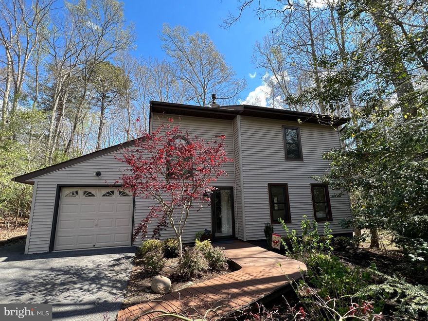 No need to do anything but move in!!! Recent renovations have been completed.  Roof, double hung windows, casement windows & skylights all replaced in 2018. New engineered wood flooring thruout main level.  New gas fireplace.  New carpet upstairs.  Freshly painted.  Stainless appliances all less than 4 years old (GE profile microwave & range) Bathroom renovations.  Semi custom maple cabinets replaced about  7 years ago. New trex decking walk way at front entrance.  Garage has an epoxy floor.  Laundry shoot! R-30 insulation in walls & R-50 in ceiling! Shows really well!!