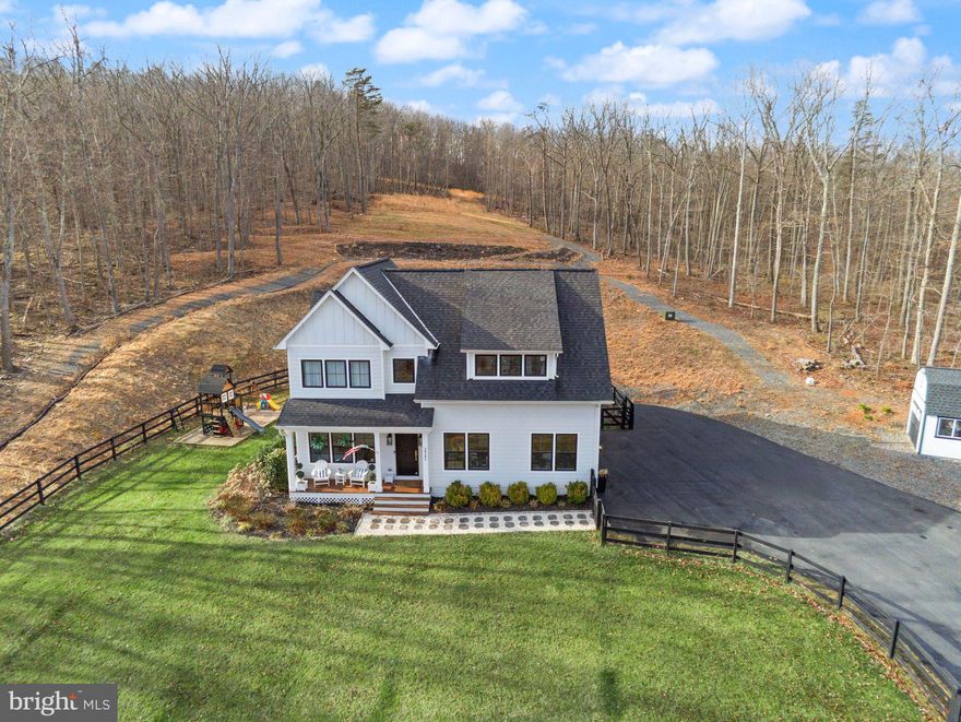 ***Back On the Market ***

Welcome home, a place to relax, feel safe, belong!

A private 10-acre Aldie estate thoughtfully curated and designed as a peaceful countryside retreat.

Set across ten breathtaking acres with NO HOA, this extraordinary custom-built residence by MAC Builders offers the rare opportunity to experience refined estate living surrounded by nature. Mature trees, open skies, and sweeping views create an atmosphere of calm and privacy while the home reflects timeless craftsmanship and thoughtful design.

Inside, a light-filled open floor plan unfolds with effortless elegance. The gourmet white kitchen, complemented by an expansive pantry and exceptional storage, flows seamlessly into the inviting family room anchored by a warm gas fireplace and the open dining area, creating a beautiful space for both everyday living and entertaining.

A main-level bedroom with a full custom bath provides the perfect setting for guests, extended family, or multi-generational living. Just beyond the living spaces, a covered porch invites you to slow down and enjoy quiet mornings, peaceful evenings, and uninterrupted views of the surrounding countryside.

Upstairs, the home offers four spacious bedrooms and three and a half baths, including a stunning primary suite designed as a private retreat. Wake to serene views and step directly onto your private upper-level deck overlooking the property. The spa-inspired primary bath features dual vanities, a freestanding soaking tub, a beautifully designed custom shower, and an impressive wrap-around walk-in closet. An upper-level laundry room adds everyday convenience.

The walk-up lower level expands the home’s lifestyle offerings with a large recreation area, custom bar, an additional bedroom, and a full bath, along with a custom-built playroom designed to inspire fun for all ages.

Outside, the property continues to impress with a fully fenced front yard, two-car garage, and a custom-built shed that can serve as a secondary garage, workshop, or additional storage space. The outdoor playset conveys with the home, adding another wonderful feature to the expansive outdoor setting.

Served by private well and septic, this remarkable property offers the rare combination of acreage, privacy, and modern luxury while remaining just minutes from Aldie, shopping, dining, commuter routes, and the best of Loudoun County living—and just 10 minutes from Middleburg, offering convenient access to its charming shops, restaurants, and historic small-town atmosphere.

A truly special Northern Virginia countryside estate where every sunrise feels peaceful, every gathering feels special, and every day feels like coming home.