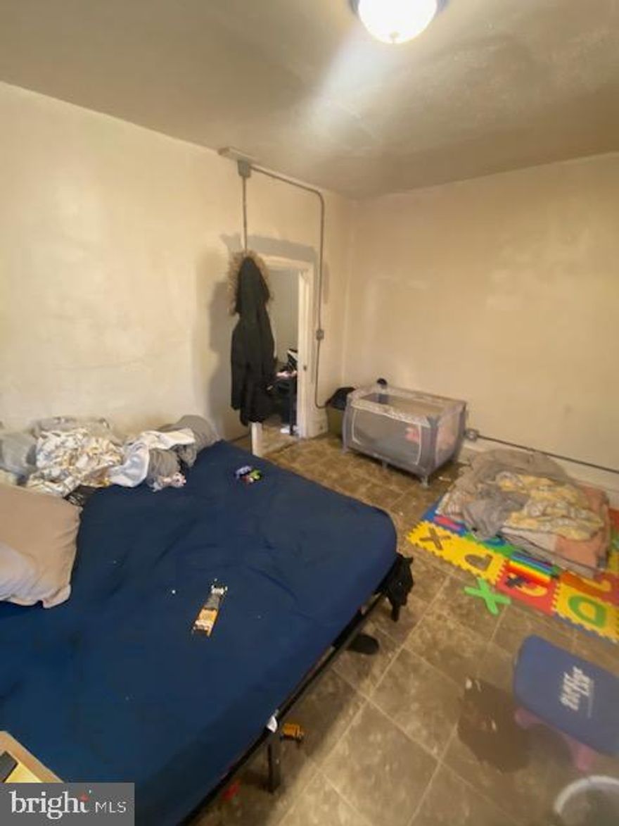 Opportunity to own a legal 3 unit building. Unit 1: Vacant. 1br 1ba, Unit 2: $900, 2br 1ba, Unit 3: $850 2br 1ba. The building has a rental license for a 3 unit residential. Perfect choice for Investor seeking a valuable asset -First time homeowner looking for smart start with added income - True gem of a property -Close to Transportation, Schools, & Shopping!