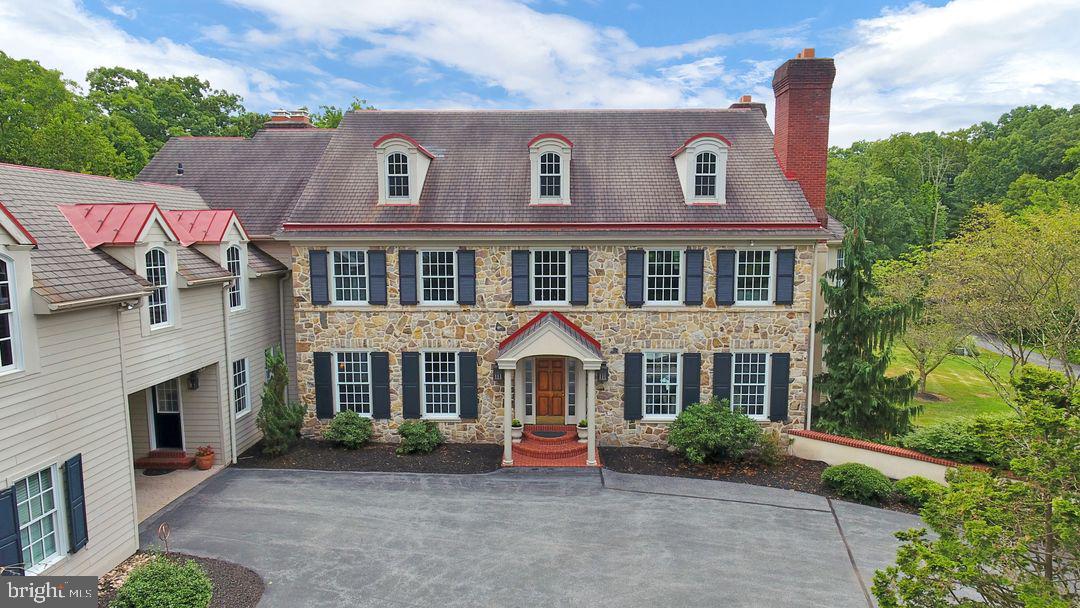 Enjoy the beauty and tranquility of this truly unique property nestled on almost 21 acres in the desirable Green Ridge Community located in Silver Spring Twp. supported by the Cumberland Valley School District. The property includes an exquisite stone pillared entrance with a winding driveway which includes a stone bridge over a stream, access to the property's barn as well as brick and stucco pillars and walls with a circular entrance once you have arrived at the front of the home. The home includes unprecedented details and suburb craftsmanship replicating elements of homes built during the 1800s with the modern conveniences and design of today including 8 fireplaces, American cherry hardwood floors, oversized Anderson windows , crown moldings, and a fabulous floor plan for entertaining on multiple levels, along with a four car garage and barn. This home is truly a one of a kind property located in one of the areas most desirable locations. Come tour your new home!
