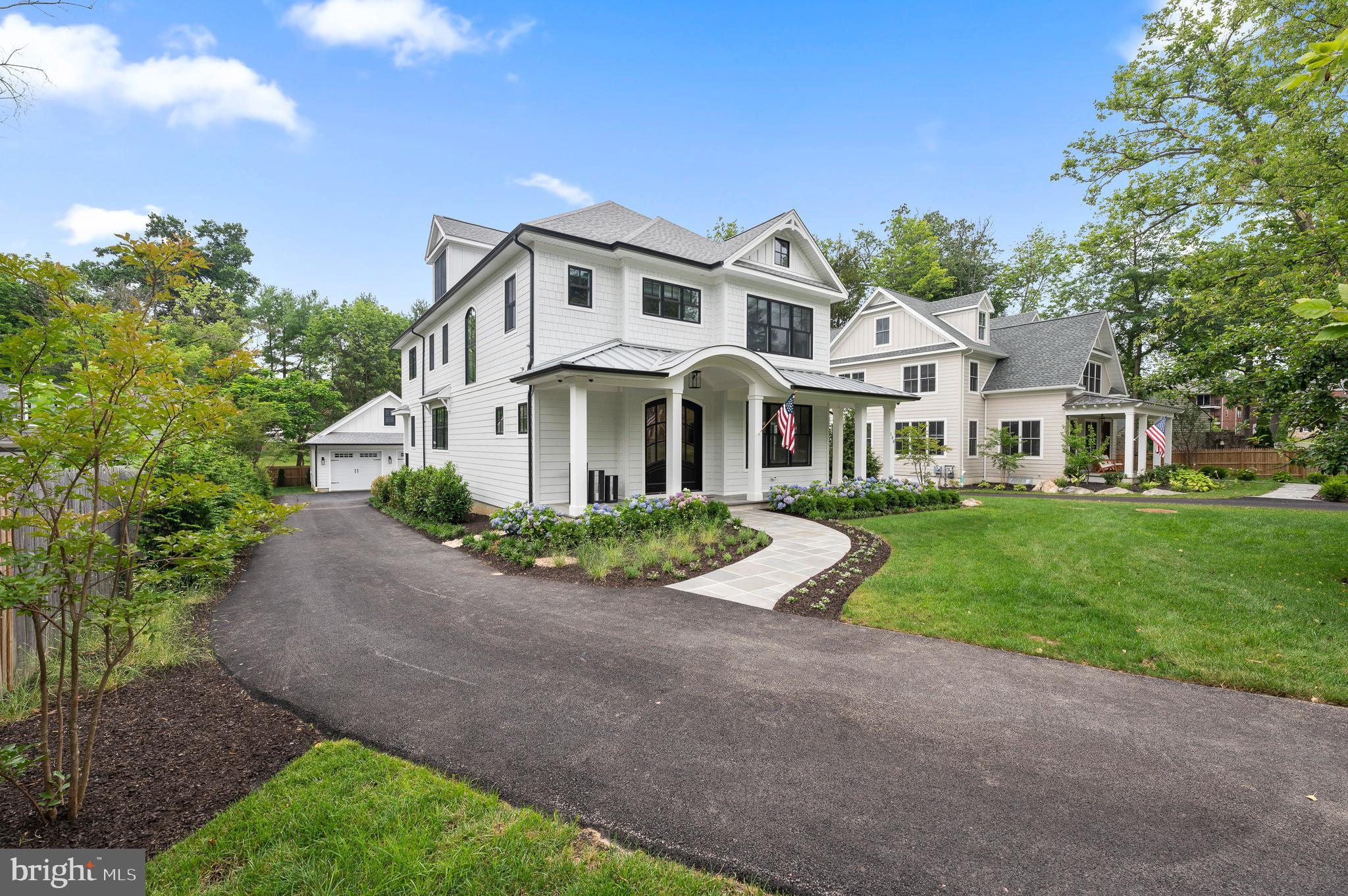 Modern Elegance Meets Everyday Convenience in Wayne
Discover a fresh and sophisticated 4-bedroom, 3.5-bath home, completed in 2021, perfectly positioned on a quiet cul-de-sac. Just a short walk to vibrant downtown Wayne’s restaurants and shops and an even shorter stroll to the St. David’s train station, this turnkey residence seamlessly blends timeless architecture with contemporary living.
Step inside to an airy, open-concept layout with wide-plank white oak floors throughout. The formal dining and living areas flow effortlessly into the centerpiece of the home: a custom-designed kitchen featuring sleek cabinetry, quartz countertops, and professional-grade stainless steel appliances. Adjacent, the sunlit family room, with its marble-clad gas fireplace, opens to an expanded composite deck—perfect for entertaining or quiet relaxation.
The main level is thoughtfully designed with a private office, powder room, and stylish mudroom. Upstairs, the primary suite is a tranquil retreat, complete with dual walk-in closets and a spa-inspired bath featuring a soaking tub, frameless glass shower, and dual vanities. Two additional bedrooms share a spacious hall bath, while a third ensuite bedroom offers privacy and flexibility. A second-floor laundry room, custom-designed with quartz countertops, adds convenience to daily routines.
The third floor presents options for additional living space, while the expansive unfinished basement offers endless possibilities. A detached two-car garage, extended driveway, and thoughtful outdoor enhancements provide both comfort and function.