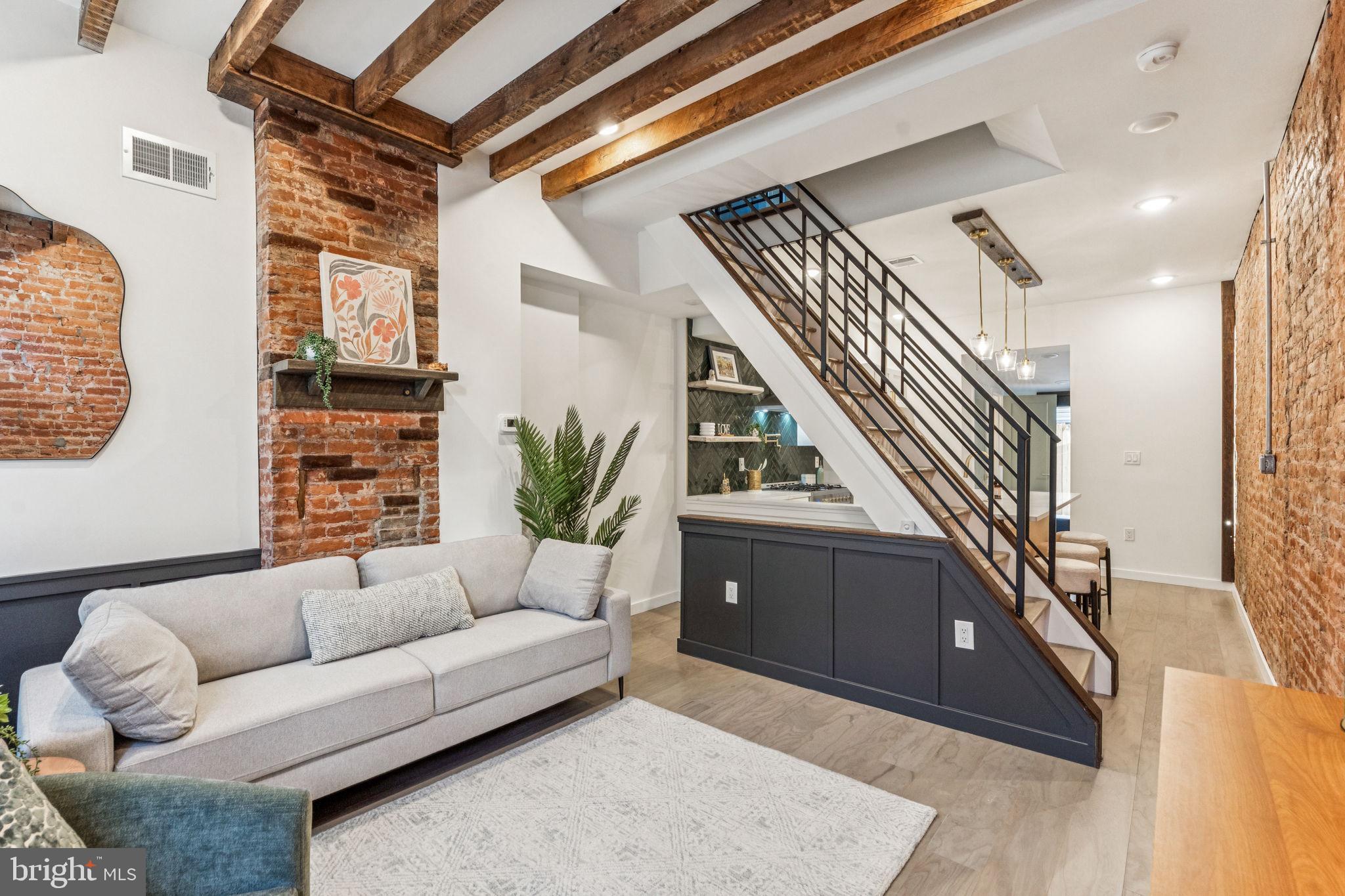 Welcome to 2728 West Cabot St, a beautifully renovated home on a fantastic block in Brewerytown, just half a block north of Girard Ave. The house has all new HVAC, electrical, plumbing, and roof, plus an APPROVED 10 year tax abatement! This unique and custom residence blends modern style with rustic charm, including exposed brick, exposed ceiling beams, and reclaimed wood accents. The house offers 2 bedrooms, 1.5 bathrooms, and a private outdoor space for relaxing or entertaining. The stylish kitchen is equipped with a 36 inch cook top/ oven, range hood, quartz countertops, modern shaker cabinetry, a designer herring bone tile backsplash, and a full stainless steel appliance package. Just behind the kitchen, you’ll find an addition with a convenient first-floor powder room, a washer/dryer closet, and an eating area bathed in natural light. The second floor offers a full bathroom and two bedrooms, each with generous closet space. The primary bedroom has a large closet and exposed brick accents. The custom bathroom vanity and floating wall shelves, each made from reclaimed wood, exude rustic elegance. The basement is unfinished and perfect for extra storage. This one-of-a-kind gem of a house is truly move-in ready!