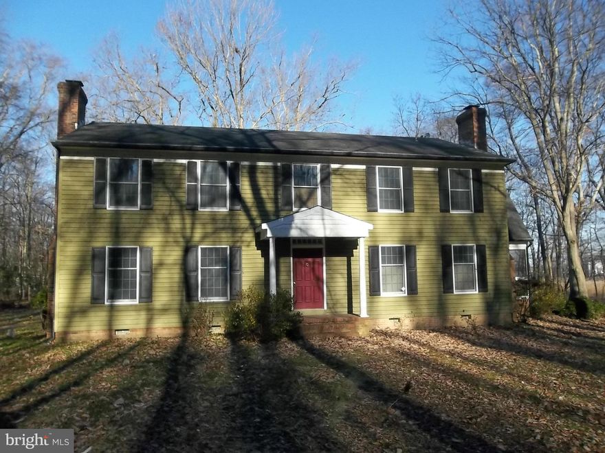 Large colonial style home features 4 large BR and 2.5 BA on over 3 wooded acres, wood floors throughout, two fireplaces, wet bar in Fam Rm, curved stair in foyer, screened porch, Two 2-car garages. Winter water view & deeded water access, needs some work but great potential here!see agent for detail on how to make an offer