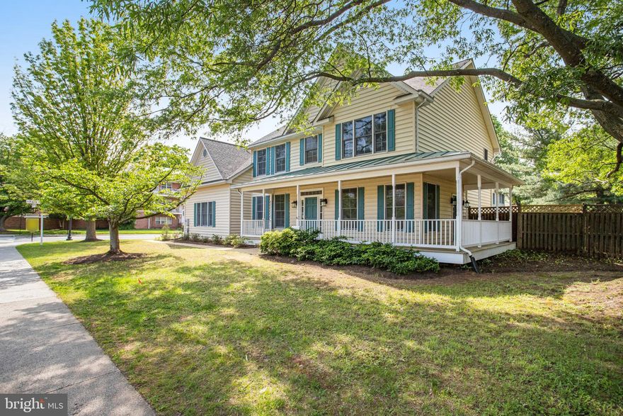 Great new price to be SO close to busy Ballston but worlds apart!  Relax on the wrap-around porch at what looks like a farmhouse but is really a classic Wills Companies-built center-hall Colonial on flat 1/4-acre lot ONLY three blocks from Ballston Quarter shopping and dining district!  Freshly painted throughout, spacious (2,750 SF living space) 12-room home built in 1995 with finished basement (1,150 SF) features four bedrooms and two bathrooms on newly carpeted upper level, newly finished hardwoods as well as handy half-bath on main level, and opportunity to make two bonus rooms in basement into legal bedrooms (two baths already there).  Two-story entry foyer with space to add an elevator greets guests into the living room with crown molding, chair rail, and windows overlooking porch; home office/library/study; and center hall to the eat-in kitchen (remodeled in 2018) which opens up to fantastic family room with cathedral ceilings and fireplace on one side as well as dining room with crown molding and chair rail on the other.  Convenient laundry room off kitchen with access to 2-car garage.  Fenced side and back yards offer a blank slate for gardeners, games, patio, and many more outdoor living options.  New roof spring 2023.  Lots of storage options.  Incredible location, near everything!