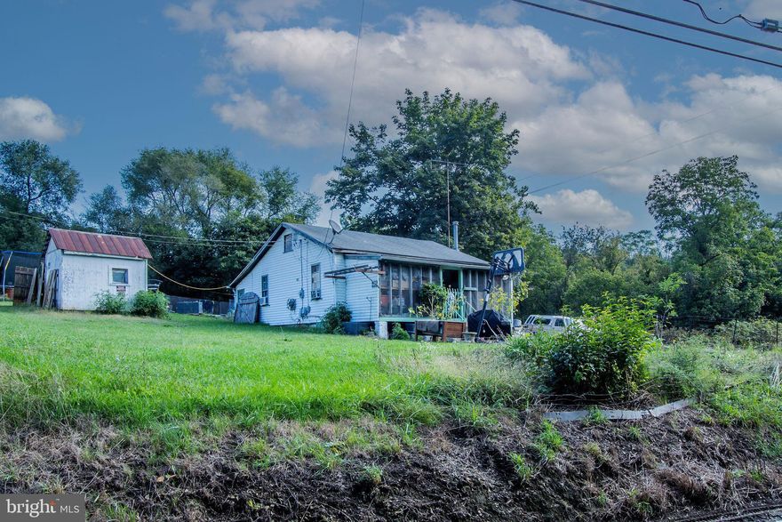 30 + Acre parcel 1 house 2 mobile, former shale pit.