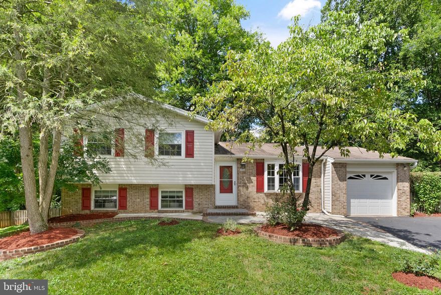 Discover this beautifully updated split-level home, featuring 3 bedrooms and 2.5 bathrooms, nestled in a quiet cul-de-sac just one mile from the Vienna Metro Station and Route 66. The main level welcomes you with gleaming wood floors, a sunlit living room complete with a bay window, and a modern eat-in kitchen that boasts new countertops, stainless steel appliances, and sleek cabinetry. The dining room opens up to a spacious deck and patio, overlooking a private, fenced backyard that’s perfect for entertaining or unwinding in peace. Upstairs, the primary bedroom offers a tastefully updated en-suite bathroom. Two additional bedrooms share a well-appointed secondary bathroom, providing plenty of room for family or guests. The lower level features a cozy family room with a wood-burning fireplace, an office nook, a laundry room, and additional storage space. A walk-out basement with a separate rear entrance adds convenience and easy access to the backyard. Recent improvements include fresh paint throughout, new carpeting, and fully renovated bathrooms. The home also features a one-car attached garage with a front-entry driveway. Ideally situated near local attractions such as the Fairfax Museum and Van Dyck Park, the location offers seamless commuting with the Vienna Metro Station and Fairfax Connector bus routes close by. For shopping and dining, explore the options at the Mosaic District and Fair Oaks Mall, or pick up fresh groceries at the Fairfax Farmers Market and Whole Foods. This home seamlessly blends comfort and practicality and is ready to welcome its new owners. Don’t miss this opportunity—schedule your showing today!