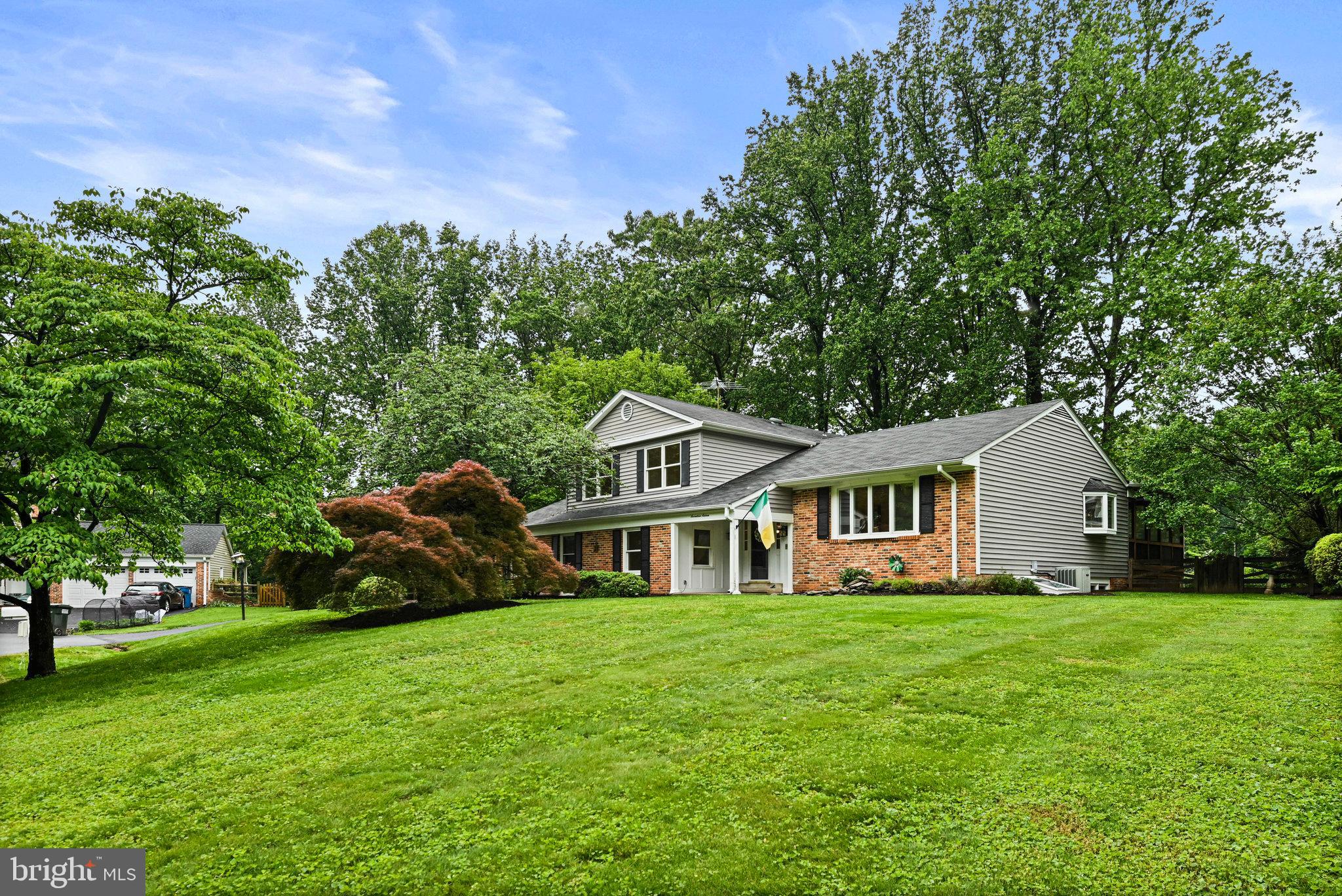 Welcome to 1716 Saddle Ridge Court!  Don't miss out on this opportunity to own a  beautifully updated 3200 finished square foot home nestled on a quiet cul de sac in Vienna. A spectacular four level, split level home on a .52 acre lot that backs to lush trees deep inside the sought after neighborhood of Wayside. This property is a nature lover's delight! Top notch school pyramid of Oakton ES/Thoreau MS/Madison HS! No HOA but active voluntary civic association. The open Foyer warmly pulls you in and welcomes you to stay awhile. Just a few steps up takes you to the Living Room which boasts a large bay window and warm wood floors. The Dining Room with a built-in wine rack and bar storage also has a large bay window, but more impressively the French doors open wide on to the large screened-in porch that overlooks the back garden and patio. The large, open Kitchen has granite countertops, high end appliances, a 6-burner gas cooktop by Dacor with a high volume Best exhaust system, and a custom artwork mural backsplash. Enjoy meals in the separate dining area or the breakfast bar. Half a level down from the gourmet kitchen is a spacious Family Room with a stunning fireplace and access to the patio and hot tub area. Also, on this level is a Full Bath, 5th Bedroom, Laundry Room and off the Family Room is access to the spacious 2 car garage. Three spacious bedrooms await you on the Upper level with two full Bathrooms.  The Primary Bedroom has access to a private deck for your morning coffee or tea and a custom extra-large walk-in closet with a full-size window and an updated ensuite large full Bathroom. The second full Bath is conveniently located on the upper-level hallway with a bathtub. Both bedroom 2 and bedroom 3 are located at the front of the home. In the finished basement, you will discover the fourth bedroom with a Murphy Bed and adjacent full bathroom. Also in the lower level is a large Recreation Room and Wet Bar as well as a Storage Room. 
 
This home offers easy access to the W&OD Trail, walking trails and beautiful parkland. The Hunter Mill Swim and Racquet Club is a ½ mile walk within the neighborhood (membership required). Commuting is effortless with proximity to the Metro, Dulles Airport, and major routes. Plus, you’re just a short drive to Tysons Corner, Reston Town Center and downtown Vienna, where world-class shopping, dining, and entertainment await.
