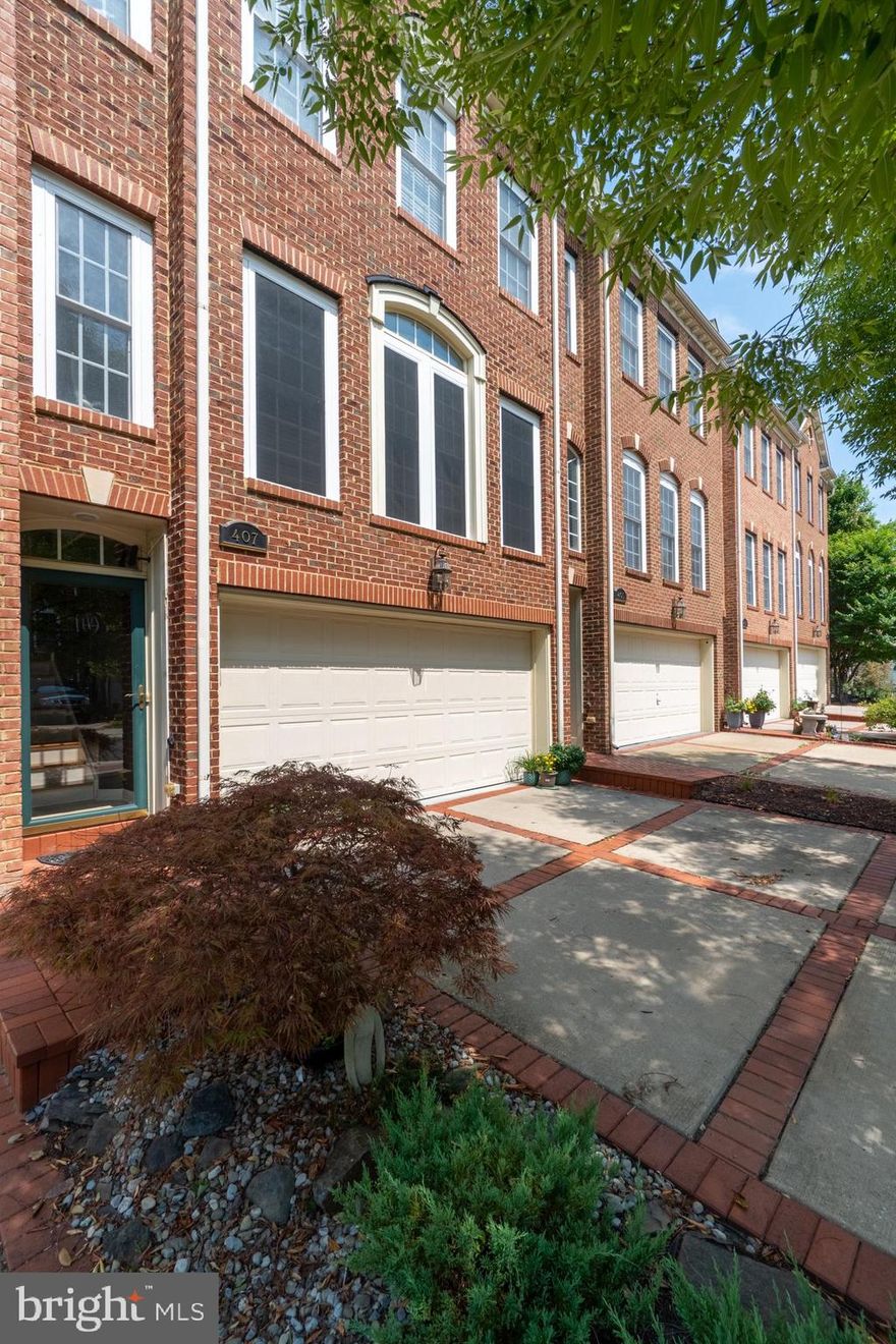 This gorgeous, 3-story, 2030 sq. ft. townhome sits in historic Greater Upper Marlboro, surrounded by an exclusive upscale gated neighborhood, small lakes, and a stunningly beautiful Oak Creek Golf Course.  

With a big, landscaped and wrought-iron-fenced backyard--that you can walk right through the front door to--and Watkins Regional Park (with tennis courts!) just 10 minutes away, this location is touched by nature all around and well-suited to an active family.

Lavishly laid out with honey-colored wood floors on the ground level, this home has stone-toned carpet on the upper tiers. There's high ceilings and 4 bathrooms here, one with an oversized oval tub big enough to float in.  

Keeping spry by staying rested is easy here.  The calming touch of the area's outdoor amenities, the building's indoor space sports a pair of master bedrooms that are easy to take your ease in -- they're both super-sized. The present owner took the original 3-bedroom configuration and combined two sleeping spaces to make this existing arrangement but willing to toss $$ to any buyer who wants to turn the site back to a 3-bedroom again.  

If you want to kick it in the kitchen, that's easy, too.  It's built open-plan and has a middle island that's made to gather around for buffets and elbow-leaning conversations.  There's recessed lighting here (and all around the house), stainless steel appliances, a double-bowl sink, an in-built oven and range, and granite counter-tops all surrounded by plenty of lacquered wood cabinetry.

Though Canaan Street is part of an exclusive golf course community with walking trails, a club house, a community pool, community restaurant, and neighborhood gym, with security personnel at its front gate, this structure maintains allusions to the area's colonial, middle-class roots, with its strong brick front built out with fine cornices and careful detail, and its pale-yellow back-end siding, with large, white-trimmed casement windows all around. 

If you want security and peace of mind that is only a few minutes from DC, and less than 5 minutes from shops, stores and restaurants, 407 Canaan is the place to be.