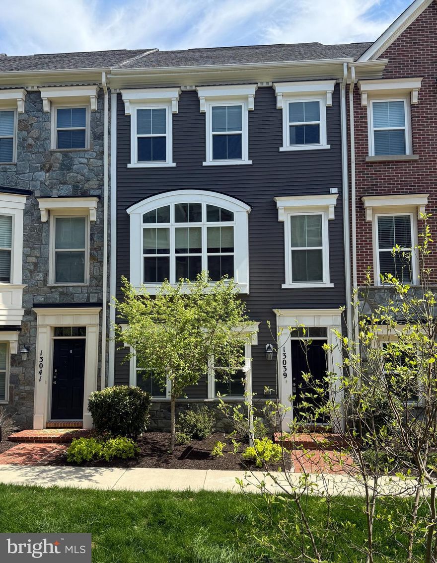 SUPERIOR VALUE IN CLARKSBURG TOWN CENTER! Fresh Paint and new carpet throughout.  This townhome offers an open floor plan for a crisp, modern feel. and is completely move-in ready, featuring 3 bedrooms, 2 full baths, and 1 half bath. The first floor includes an open, versatile space that can easily adapt to your needs—home office, gym, playroom, or second living area. Upstairs, the main living level is filled with natural light and anchored by a huge bay window, while the open-concept layout flows effortlessly into the kitchen and dining areas, making everyday living and entertaining a breeze. Step outside to the deck, perfect for relaxing or hosting guests. 

The home fronts common space and is set within a vibrant, amenity-rich community offering a pool, walking trails, community center, amphitheater, and fishing ponds. Even better, the neighborhood is planned to include a future retail shopping center with a grocery store and restaurants, plus a new public library. Convenient to Clarksburg Premium Outlets, multiple parks, and major commuting routes—this is smart living with room to grow.