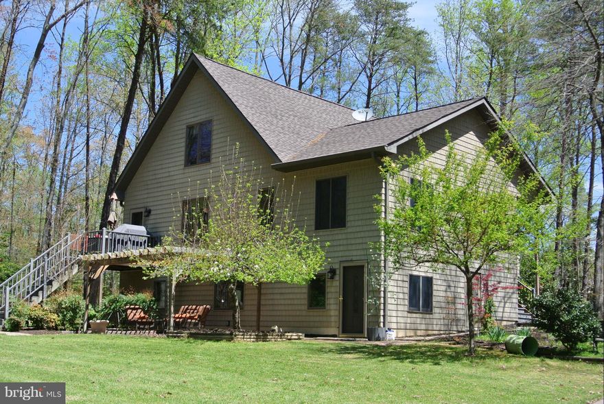 Welcome to Paradise. Large home in beautiful country setting features Bolivian Rosewood floors, upgraded kitchen, double enclosed sunrooms, fully finished basement for entertaining, & separate mudroom entrance. Relax on your patio under the pergola overseeing a gardener's delight. Bring the extra cars & toys, home features an extra 3 car garage with plenty of storage & separate paint booth.