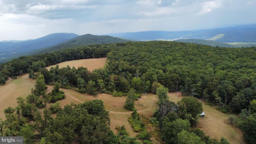 Exceptional Views!  Star Gazer's Dream. Almost Heaven West Virginia. Get away from everything and come take a look at this prime property, you won't regret it! The views are spectacular! This  170 acres has exceptionally good Topo. The homestead has been family owned for 58 years and has electric, numerous outbuildings and a Tranquil Rustic Cabin overlooking the pond.  You can hunt, shoot, ride jeeps, ATV, UTV on the existing trails.  The property is listed as an active farm in the Local Tax System. Bring the cows, horses, and other farm animals. Good water supply from 2 springs on the property. The possibilities of what you can do with 170 acres are endless.  Numerous building sites to build your dream home. Neglected Family Cemetery on the property. Just a short drive to the Village of Lost River. This is a property you don't want to miss out on!