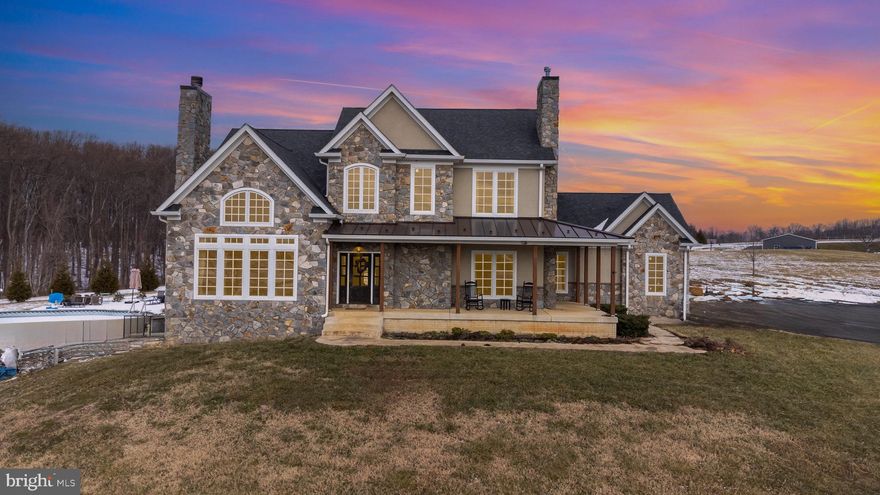 This one will blow you away!  Gorgeous stone work home sitting on just over 4 acres surrounded by northern Harford County farmland.  Only 10 minutes from Bel Air, this 3 bed, 2.5 bath home with a two car garage sits a rural setting with a modern country feel both inside and outside.  Take the private driveway to the parking pad for pull into the two car garage.  A walkway from the driveway leads to a large covered front porch that offers a beautiful view of farmland which has a 100 year no build permit.  The property itself is majority cleared, private and has trees planted around the rear perimeter for privacy.  Entering through the front door brings you into the two story foyer, looking out over the open concept main floor.  Bamboo floors sprawl out in front of you with the massive grand room with vaulted ceilings to the left and the kitchen and casual dining area ahead.  The grand room has a large stonework wood burning fireplace and is encased in high quality custom Caseman windows giving a spectacular view of the country surroundings.  This room opens straight into the gourmet kitchen.  The kitchen hosts a large soapstone kitchen island with soapstone counters.  All high end stainless appliances including a huge 54" Viking gas stovetop and double wall ovens, and even a pot filler built into the custom stonework backsplash, and gorgeous custom vent hood.  All stonework in and out of this home was handpicked from a quarry in North Carolina and custom mixed to bring out the harmony of colors.  The custom cabinetry throughout the kitchen reaches the 9' cielings.  Off of the kitchen is a casual dining area with French doors that lead out onto a stonework patio and eventually the large rear yard.  The stonework patio leads to and surrounds the swimming pool which offers a gorgeous view while relaxing.  Back inside off of the casual dining area is a sectioned off formal dining area with windows looking out onto the rear yard.  A short hallway from the kitchen lets to a private office with French doors, a powder room, walk in laundry room, and exit into the two car garage.
Taking the stairs up to the second floor brings you to a hallway that overlooks the grand room below.  In this hallway is a full modern bathroom, and three bedrooms, all with 9 ft ceilings throughout.  One of these bedrooms is the owners suite with a private gas fireplace, two walk in closets and an amazing private bathroom.  This bathroom has a large double vanity, slate flooring and a stonework jacuzzi tub and large double shower that you need to see to believe.  The modern rustic vibe of this home is wrapped up wonderfully in this private retreat right in your bedroom.  Taking the stairs to the basement brings you to a massive unfinished area with unlimited room for storage or customization to give you all the living space you can dream of.  There is a rough in for a bathroom down here, as well as walk out French doors to the side yard, and mechanicals including a tankless hot water heater for unlimited hot water.  This home, just built in 2017 was masterfully made with custom high end finishes throughout and sits on a beautiful location with a rural setting outside and a rustic modern getaway inside.
