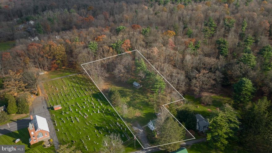 Step into the charm of yesteryears at 153 W Ridge Lane. A traditional two-story farmhouse in the idyllic setting of Warriors Mark. Generous-sized living room, eat-in kitchen, and half bath grace the main floor with 3 bedrooms and a full bath on the 2nd floor. This sweet home boasts 1,240 sq. ft. of living space. Gorgeous hardwood flooring and wainscoting add character and warmth. If you love character and charm this home has it all. Situated on a sprawling 1.70-acre lot, this home offers the perfect blend of spacious country living and old-world charm. Enjoy your morning coffee or a quiet evening on the relaxing front-covered porch, taking in the peaceful surroundings. Large exterior shed/outbuilding that can be used for many purposes. Tenant occupied until 6/30/24. Interior photos are available upon request.
