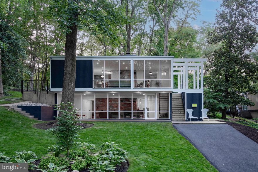 Welcome to this iconic Hollin Hills house, prominently featured on the Hollin Hills Wikipedia page. Designed by the renowned architect Charles Goodman, this two-story mid-century modern home has been completely remodeled from top to bottom, seamlessly blending vintage charm with modern amenities.

Entry addition with dramatic steps leading to the front door and ample exterior storage space.  
4 bedrooms and 3 full baths including a stunning new addition to the primary suite.  Features two walk-in closets, a wall safe, and a luxurious en suite bathroom equipped with heated floors, a bidet, dual shower heads, and a teak double vanity. Primary suite rear entry leads to a private paver patio, ideal for secluded relaxation. Light-filled living room, with wood-burning fireplace that is plumbed for gas logs. New double pane floor-to-ceiling windows offering expansive views and abundant natural light throughout the house.
Remodeled open concept kitchen with Kitchen Aid appliances, quartz counters, wine rack and breakfast bar. 
Large deck off kitchen features cable railing and provides an excellent space for entertaining guests.

Light filled lower level with exposed brick wall, wood-burning fireplace and high end wide plank engineered wood floors. Open steps with soaring walnut acoustic paneling and built-in indoor planter. Custom wet bar with beverage fridge is perfect for entertaining.  Fourth bedroom with exterior entrance and dual entry full bath makes this a perfect au-pair / in-law suite.  
Separate laundry room with refinished vintage Youngstown metal sink cabinet and stackable washer and dryer.  Finished bonus room could be theatre room, office or gym.  Loads of storage with three coat closets, and huge double storage closet with shelves 

Original features retained throughout including Goodman stair railing; a nod to the home’s architectural heritage, walls of brick adding texture and historical significance, vintage lighting preserved to maintain the mid-century modern aesthetic.  This home is a perfect blend of historical significance and modern luxury, situated in the desirable Hollin Hills community. Enjoy the charm of mid-century modern design with all the conveniences of contemporary living.