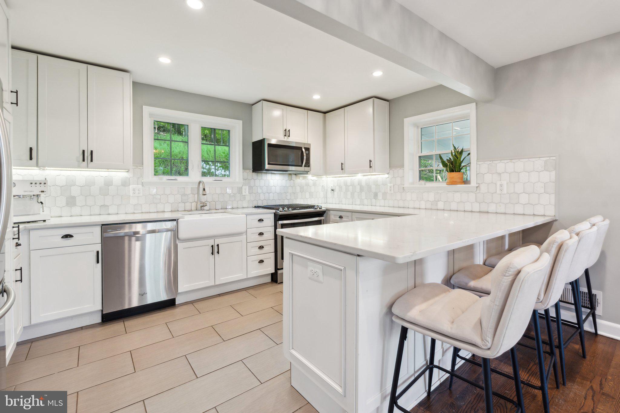 ✨ Gorgeous Fully Renovated Home in Ruxton/Riderwood! ✨
Welcome to this beautifully updated porch-front Colonial tucked away in the highly sought-after Ruxton/Riderwood neighborhood. Offering the perfect blend of classic charm and modern design, this stunning 4-bedroom, 3-bath home sits on a private wooded lot while still providing quick access to everything you need.
Step inside to find gleaming hardwood floors and a bright, open-concept layout. The chef’s kitchen is a true showstopper, featuring quartz countertops, stainless steel appliances, a peninsula with seating for four, and crisp white cabinetry that flows seamlessly into the dining and living areas—perfect for entertaining.
Upstairs, you’ll find three spacious bedrooms and two beautifully appointed full baths. The finished lower level offers additional living space, ideal for a family room, home office, or gym.
Outside, enjoy a private wooded lot, a welcoming front porch, and a one-car garage. Major updates include newer windows and roof, giving you peace of mind for years to come.
📍 All of this in an unbeatable location—minutes from 695 and I-83, with easy access to Baltimore, Towson, and Hunt Valley. And the best part? A single-family home in Ruxton/Riderwood for under $550K!
Don’t miss this rare opportunity—schedule your private tour today!